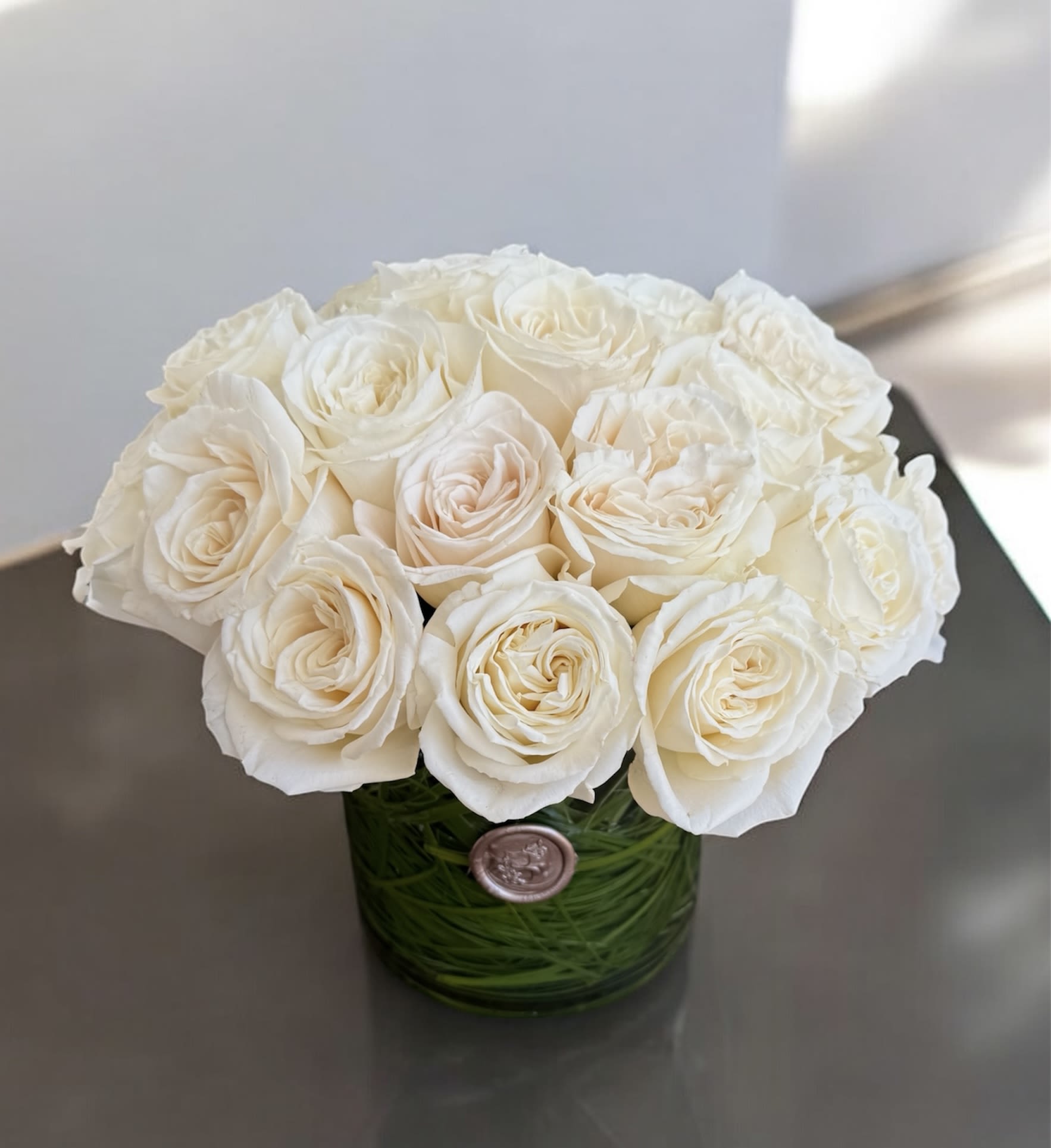 Two Dozen Roses  - Twenty-four beautiful roses arranged in a clear glass vase. A classic and thoughtful way to show love, appreciation, or celebrate a special moment.  Looking for a different color? Just leave a note for the florist at checkout, and we’ll create it in your preferred shade.