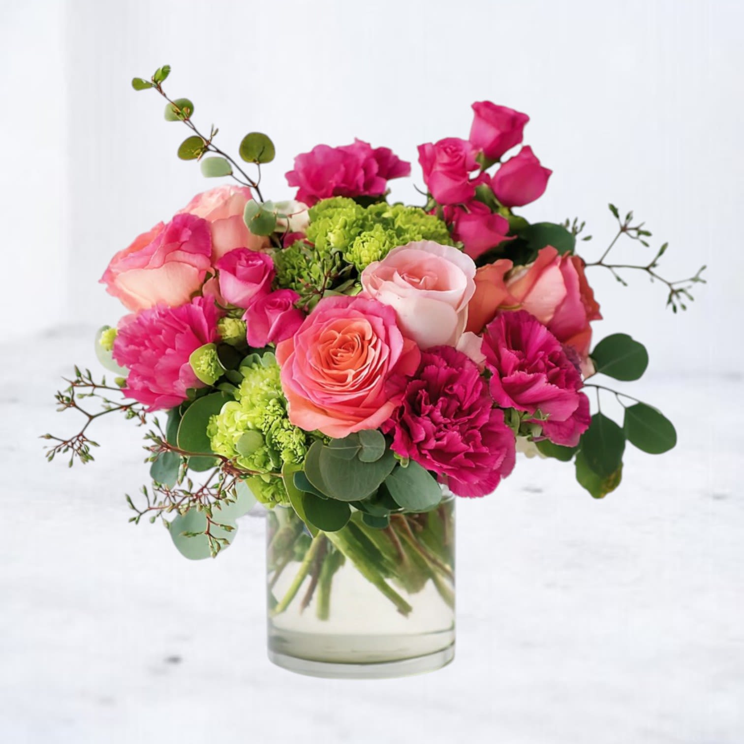 Flora Fizz - Effervescent and full of charm, Flora Fizz is a vibrant floral arrangement that brings joy to any room. Bursting with lush peach roses, raspberry-pink spray roses, delicate lisianthus, and refreshing green hydrangeas, this bouquet is a celebration of color, texture, and whimsy. Accents of green berries and soft greenery add a playful finishing touch to this garden-inspired design.  Perfect for birthdays, anniversaries, thank-you gifts, or just because—Flora Fizz offers same-day flower delivery in Houston, Texas, and surrounding areas. Send a pop of color and happiness with this luxurious floral arrangement that’s as unforgettable as a glass of sparkling rosé.