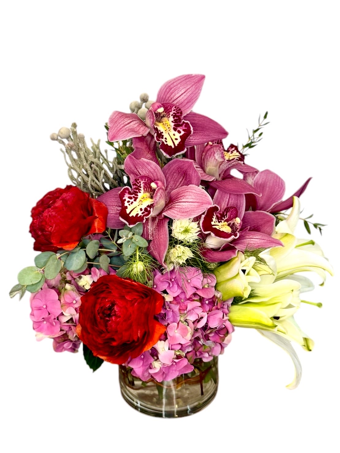 ROMANCE XO - ORCHID,ROSES,RANUNCLUS HYDREANGEA,LILIES We may replace stems to deliver the freshest bouquet possible, and we may sometimes need to use a different vase or different greens for sub materials 