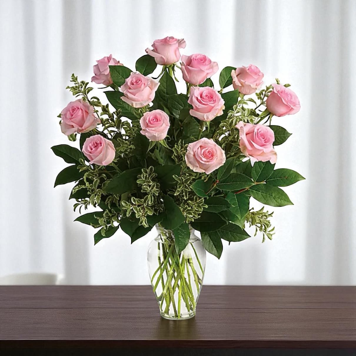 Dozen Pink Roses - A dozen beautiful pink roses, with lush greenery in a vase 
