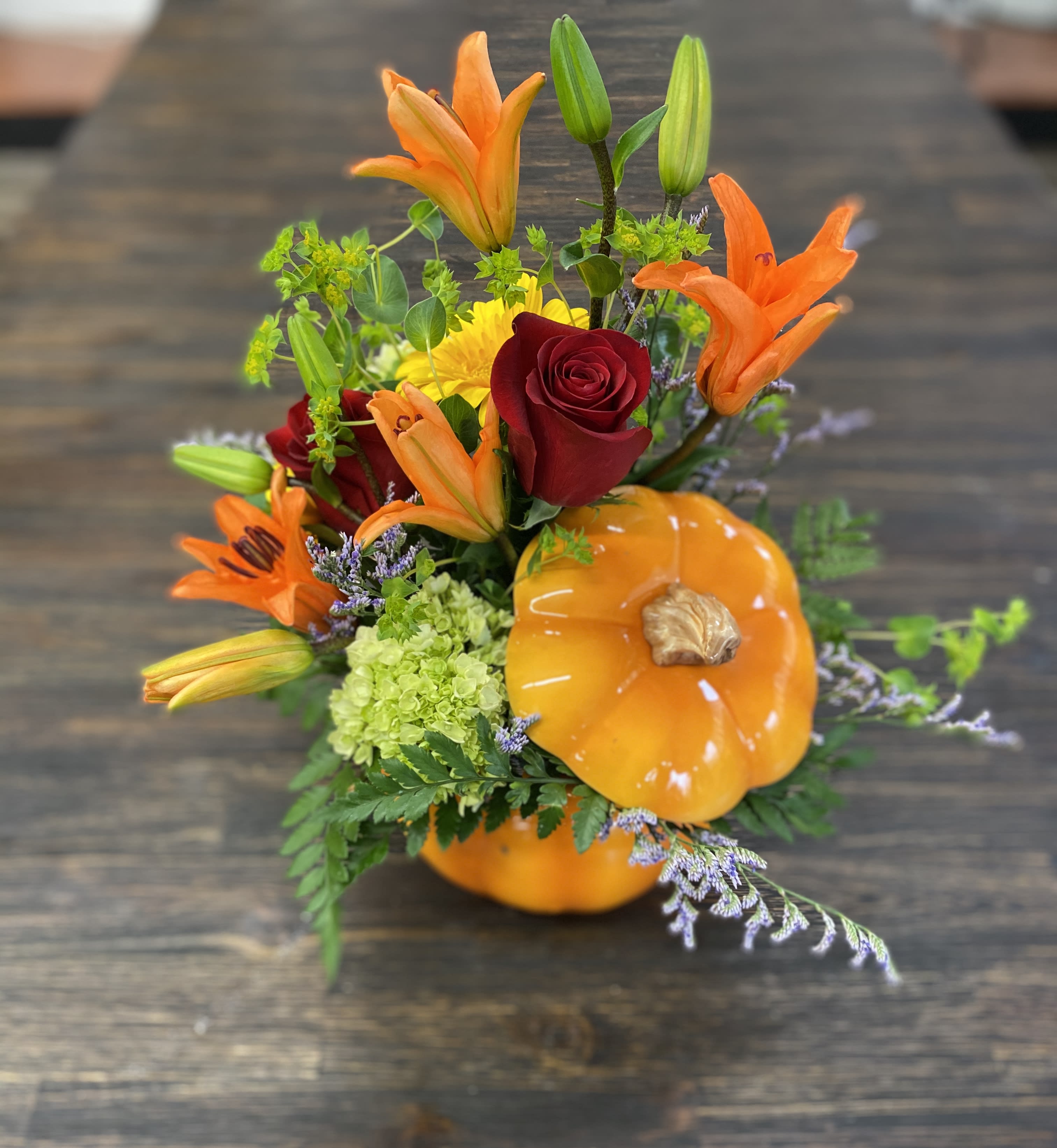 Pretty Pumpkin Pretty Pumpkin - Beautiful ceramic pumpkin vase with red roses and an array of fall flowers. Perfect for the season!