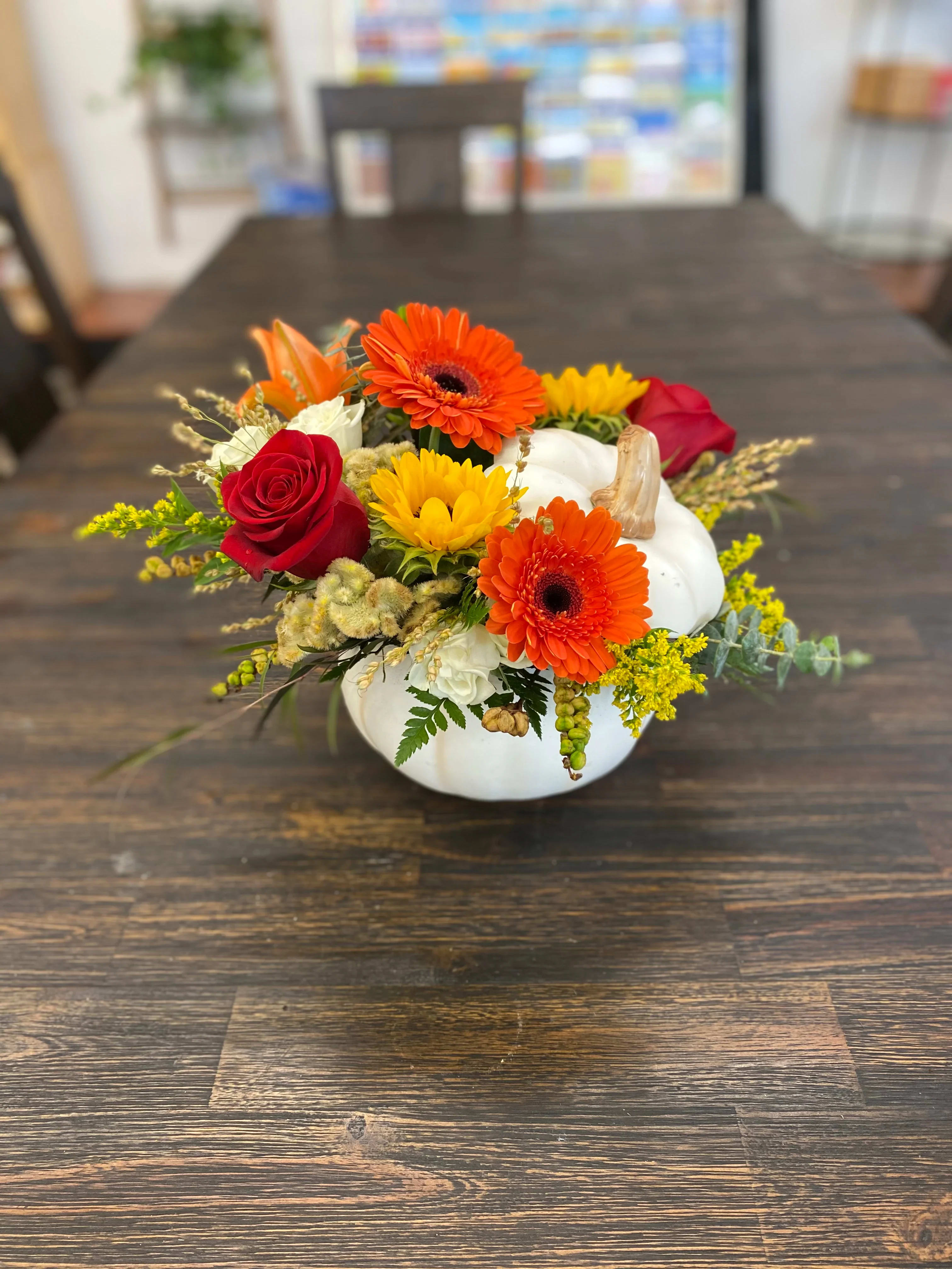 Enchanted Autumn Enchanted Autumn - Beautiful white pumpkin filled with fresh flowers and autumn tones