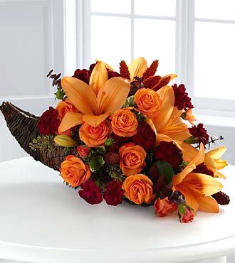 Cornecopia Overflowing - Fall flowers in a traditional cornecopia for any home with fall colors to include yellows, oranges, and burgundy.  Roses, lilies, and mums...mixed fall flowers.