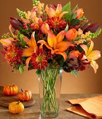 Lilies and Lovely - Beautiful lilies, roses, and snapdragons, in a vase in bold fall colors.