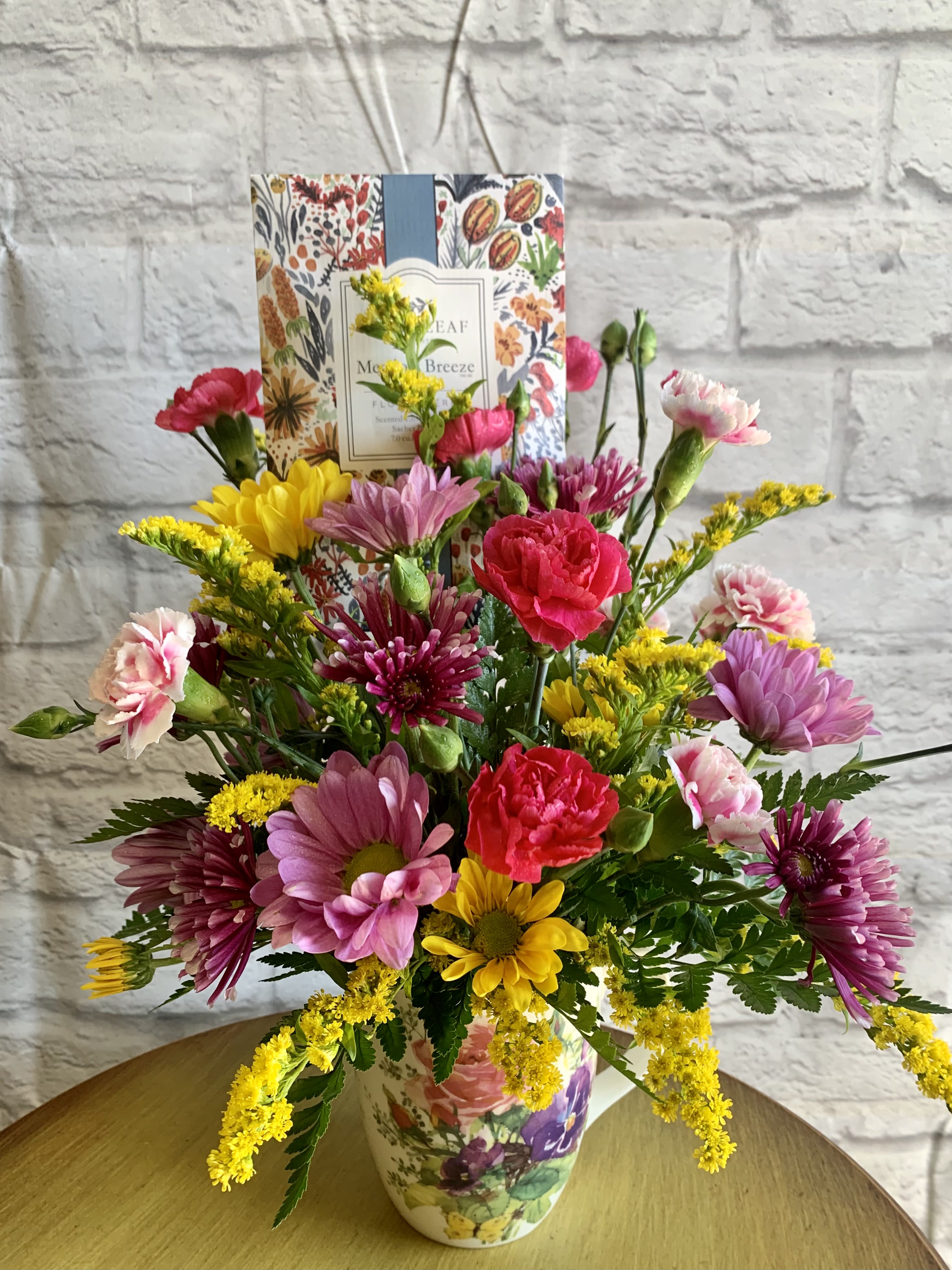 Meadow Breeze Meadow Breeze - A 16 oz. porcelain mug is filled with fresh "wild" flowers & includes a fragranced sachet! Mug and flowers will vary to make each one unique.