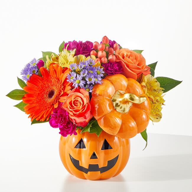 Tricks and Treats Pumpkin Bouquet - This festive ceramic Jack-o-lantern arrives with a colorful fall mix sure to delight anyone