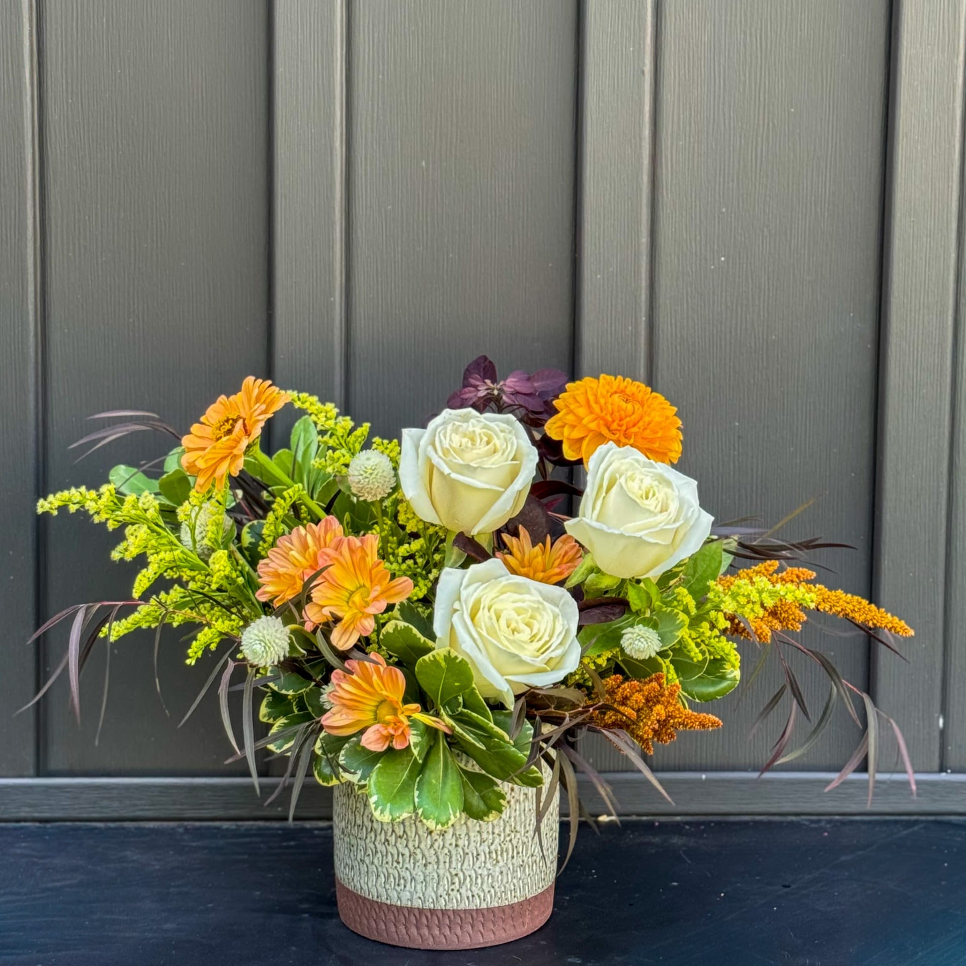 Sweater Weather Sweater Weather - A charming seasonal arrangement that captures the essence of autumn's warm hues and natural beauty. Standard size measures approximately 13" x 15" in a 4.5" x 4.5" ceramic container.