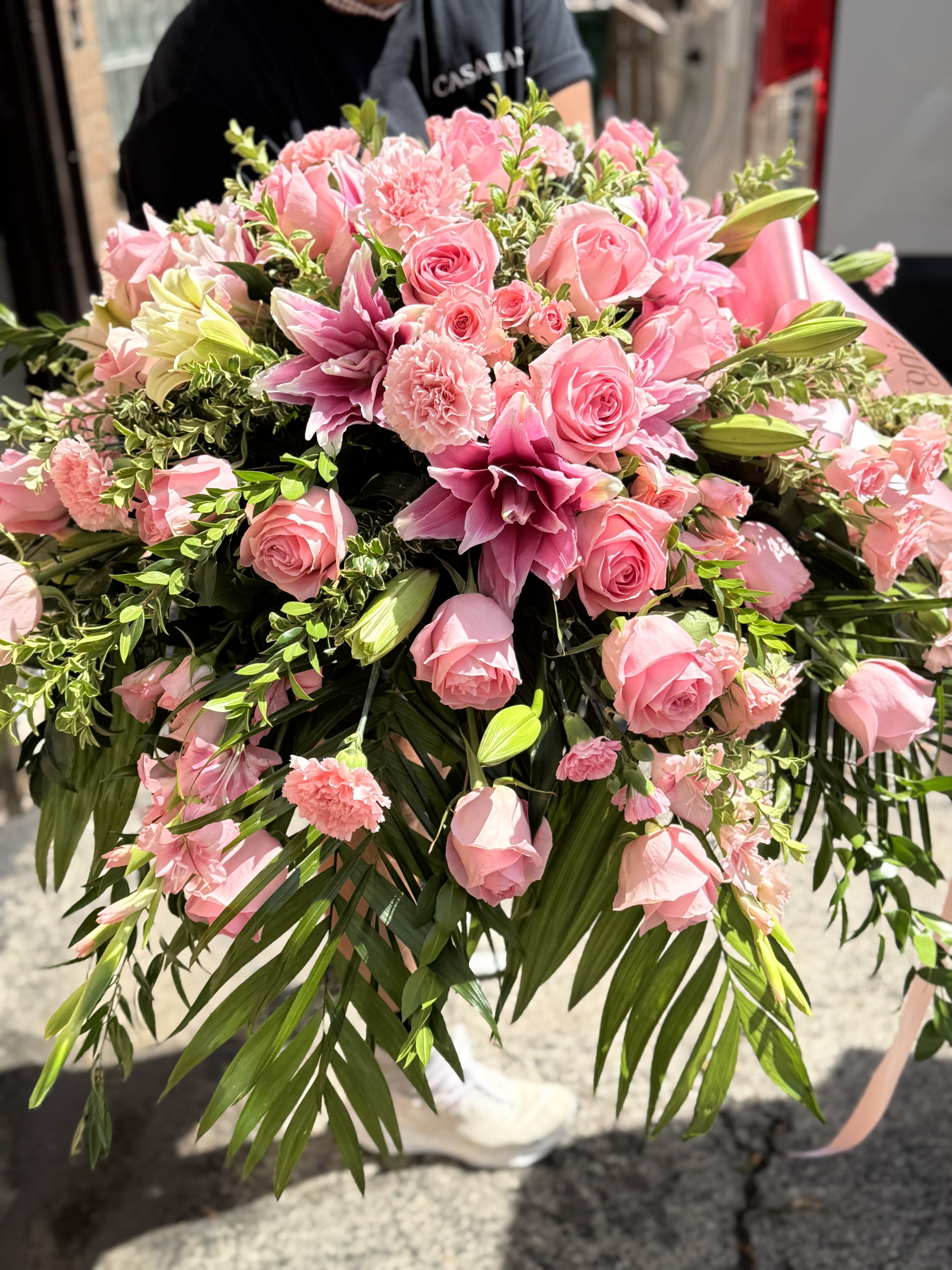 Timeless Beauty Casket Spray  - Pink lilies, roses &amp; pink gladiolus arrangement placed on top of the casket 