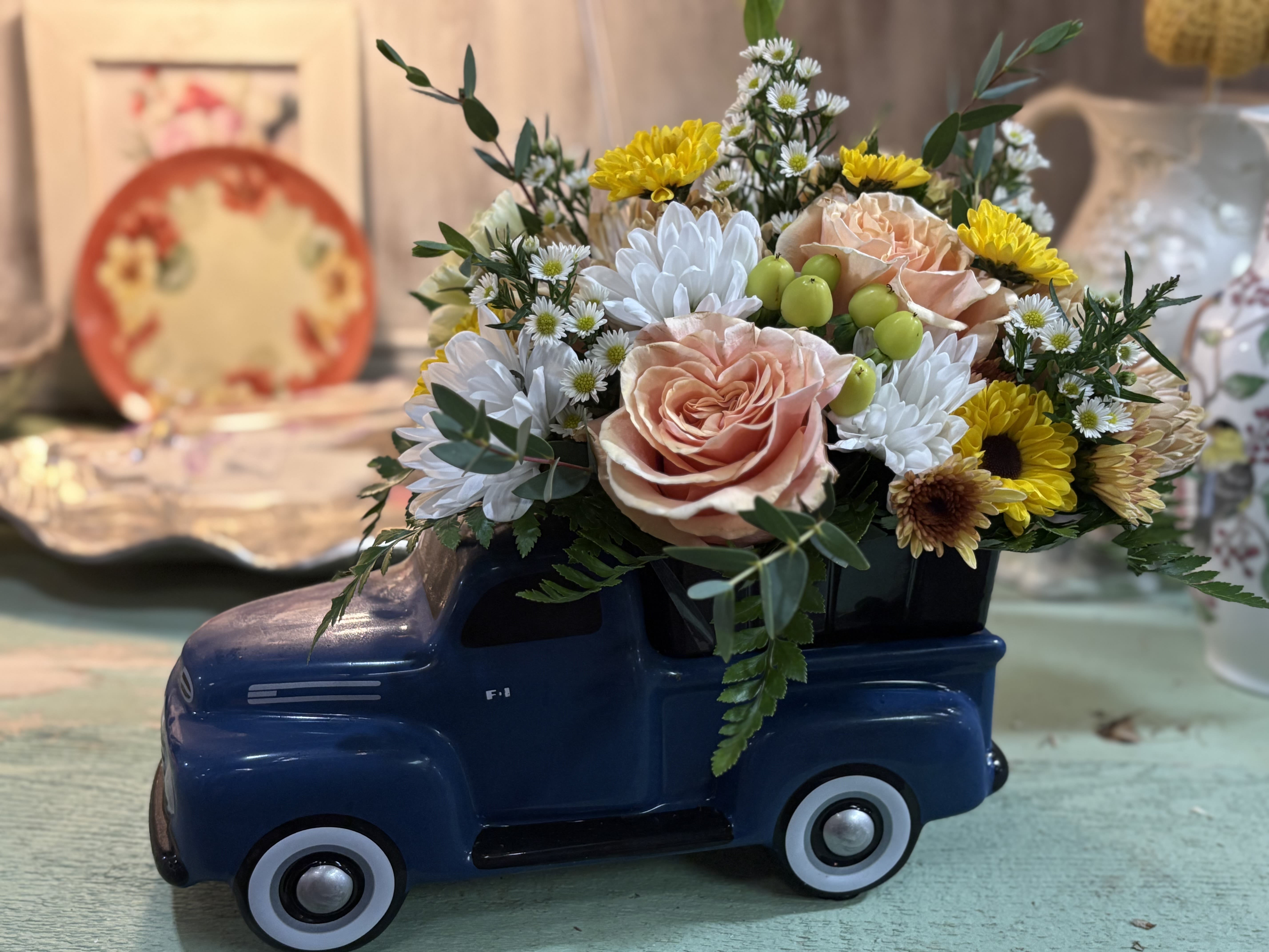Ford Blues Ford Blues - 48' Ceramic ford truck adorned with peach roses and a variety of blooms. Perfect for the vintage car lover of your life.