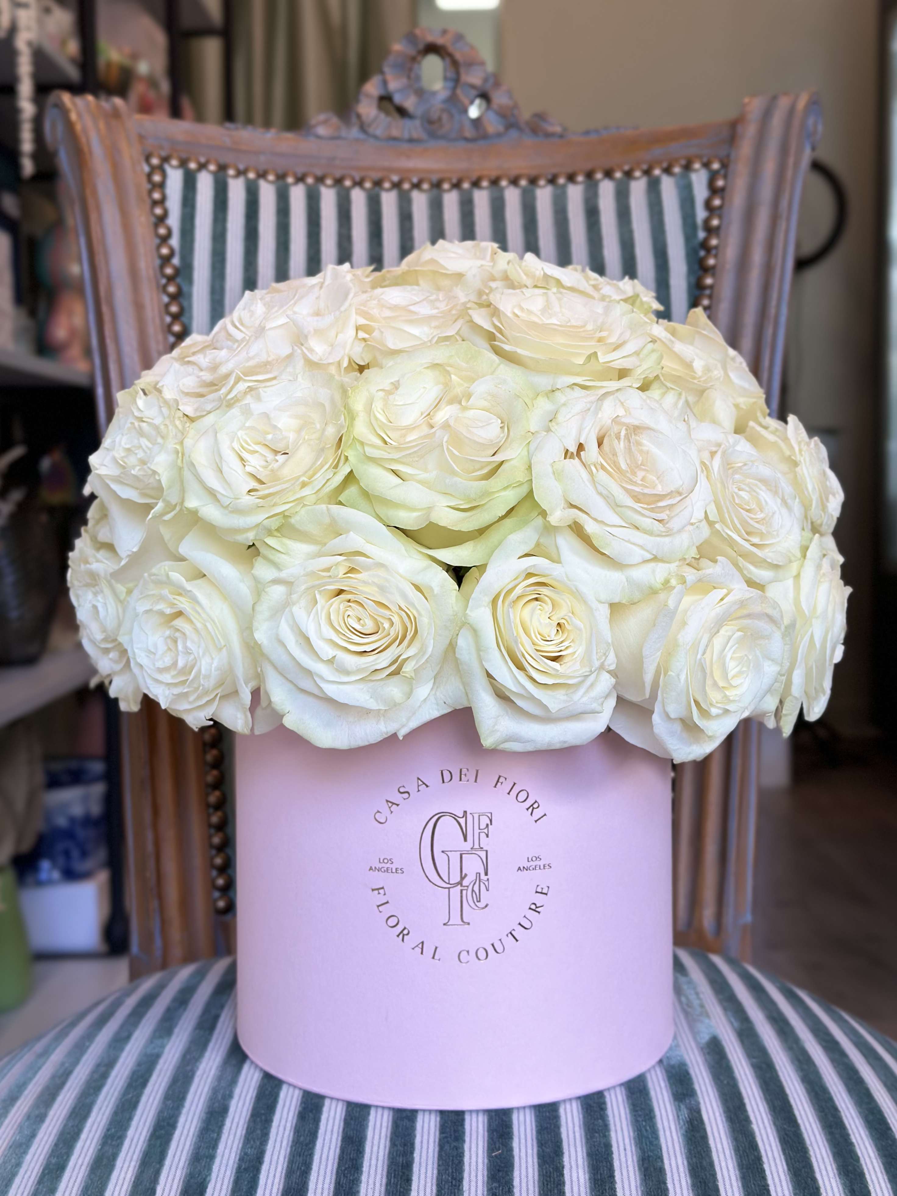 White Rose in a Box  - A luxurious hatbox filled with premium white roses, symbolizing purity and elegance. This timeless arrangement makes an unforgettable gift for any occasion. Flower type: 30 stems of white roses.  It’s possible to do roses of any colour.  Possible sizes: S 30 - $120,  M 50 - $200, L 75 - $262