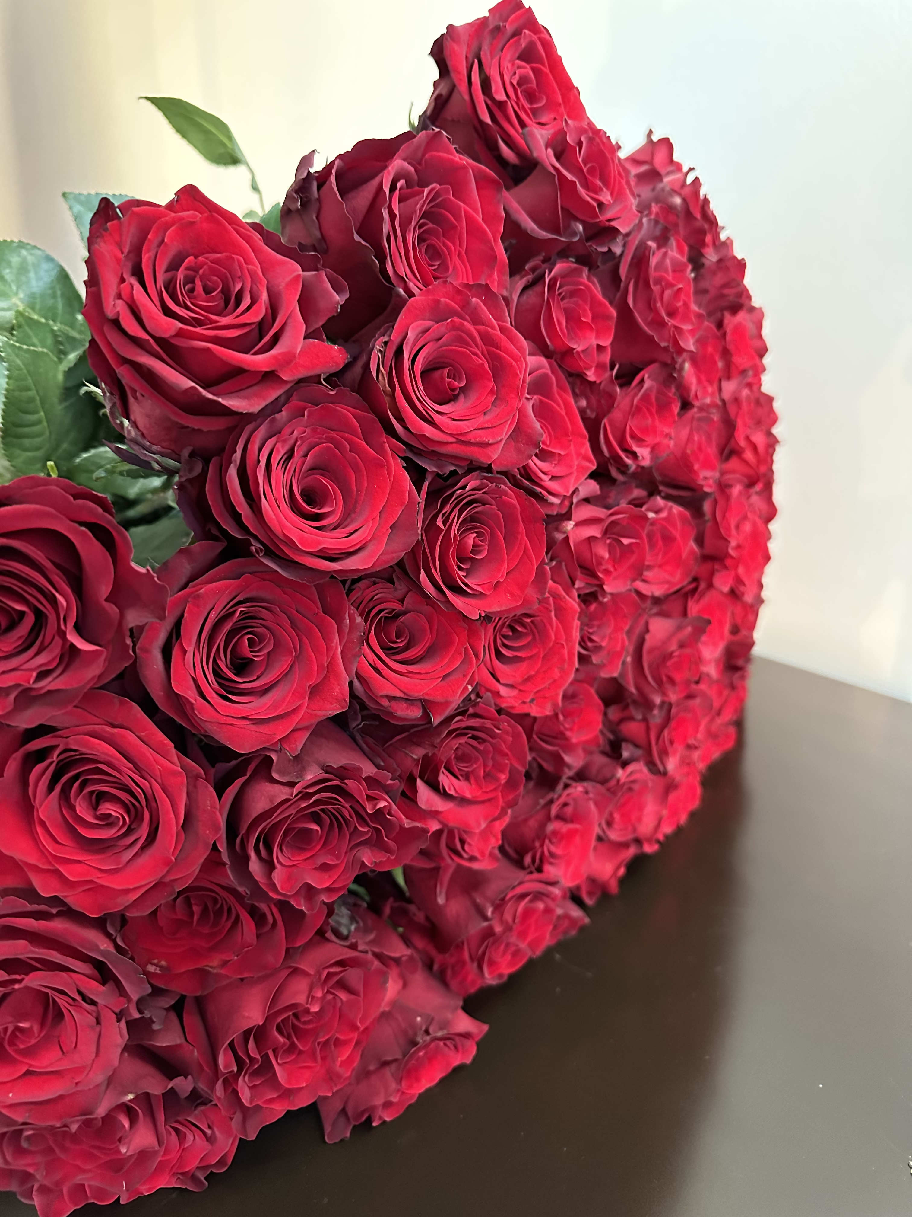 Royal Roses - A luxurious bouquet of premium red roses, carefully selected for their perfect shape and freshness. A true symbol of love and passion, this arrangement is the ideal gift to make any moment unforgettable. We are able to do a bouquet of 100 roses - $249