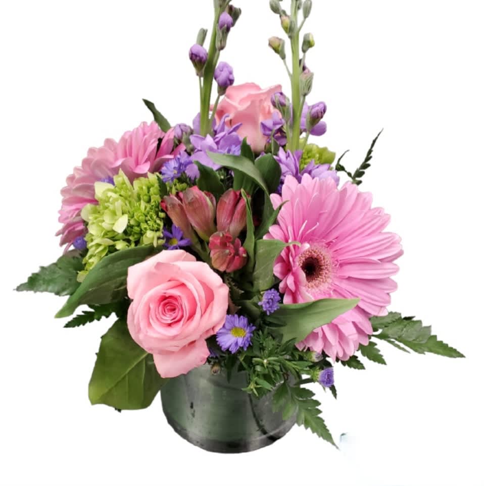 Happy Day Happy Day - Happy Day Floral Design Brighten anyone’s day with this cheerful and compact bouquet! Artfully arranged in a leaf-wrapped glass vase, this low design bursts with color and charm. Featuring mini hydrangea, vibrant gerbera daisies, delicate alstroemeria, fragrant stock, and classic roses, it’s the perfect pick-me-up for any occasion. Whether it's a thoughtful gift or a treat for yourself, this joyful arrangement is sure to spread smiles. ***PLEASE NOTE due to demand the stock could be white not purple ** due to demand vase maybe cube, cylinder or bubble bowl.