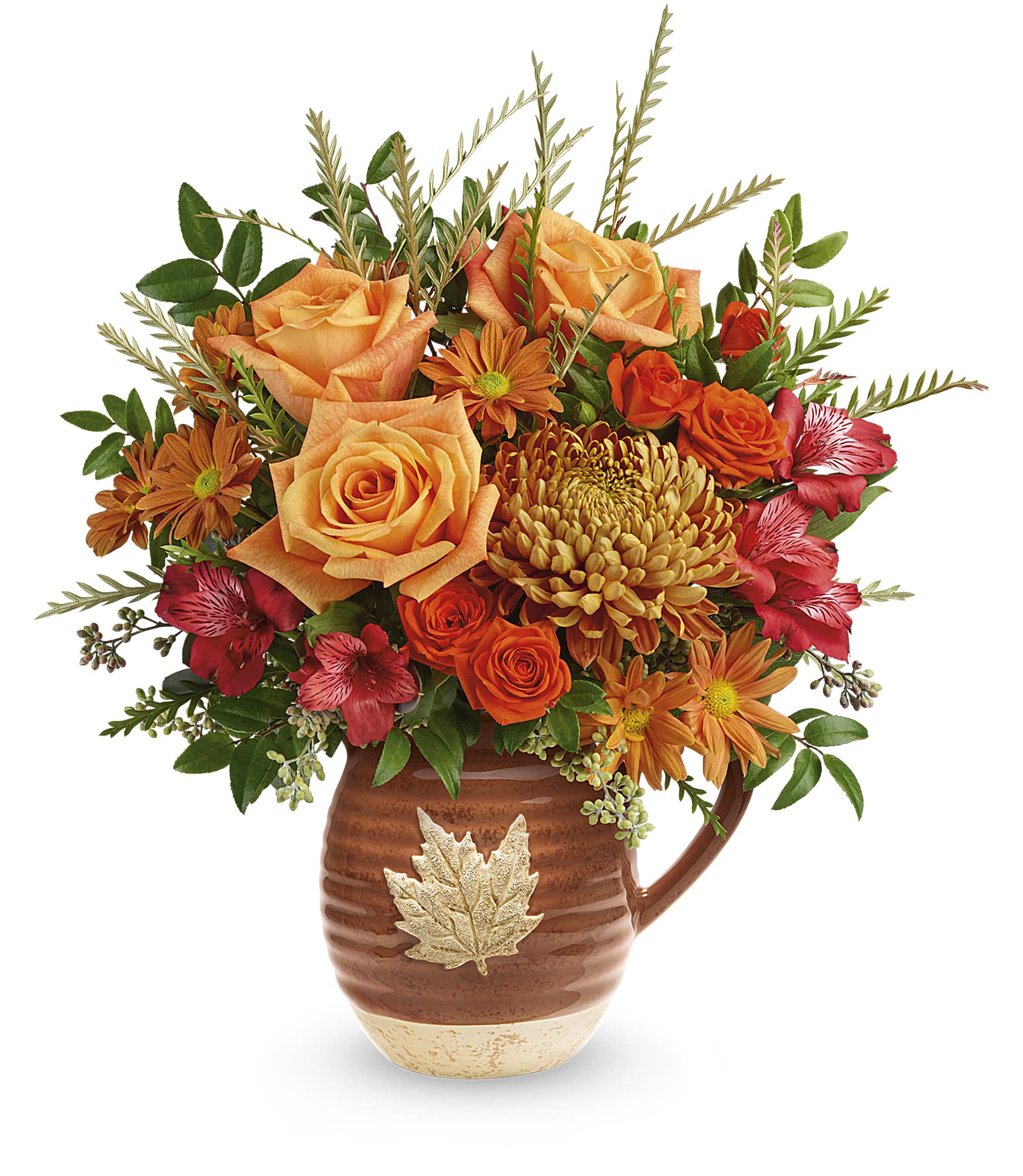 Teleflora's Cascading Blooms Bouquet - Capture the beauty of cascading fall leaves with this heartwarming rose bouquet in a gorgeous, glazed ceramic pitcher that's food safe for serving. Perfect to decorate your table for Thanksgiving or any special occasion.