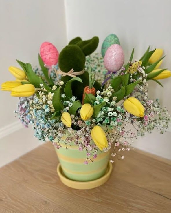 Springtime Enchantment - This Easter bouquet combines the traditional beauty of yellow tulips with whimsical and thematic elements, creating a delightful and eye-catching arrangement perfect for Easter celebrations. Whether displayed as a centerpiece or given as a gift, this bouquet captures the spirit of the season in a joyous and creative way.