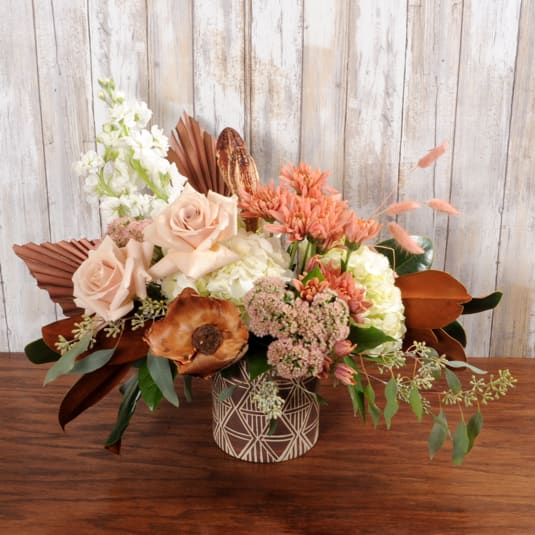 Desert Beauty Desert Beauty - Over the top floral arrangement with beautiful fall flowers.