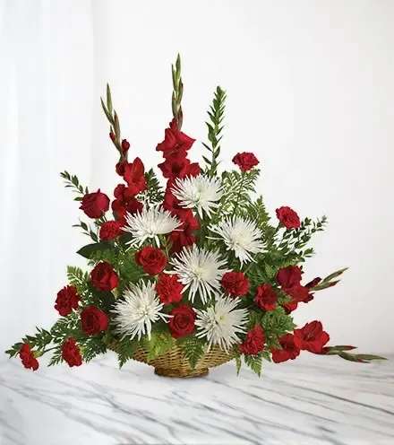 Honored Grace Honored Grace - Honored Grace is a magnificent arrangement that is perfect for expressing your sympathy. Arrives in a wicker basket. Basket may differ from one shown. Perfect for the memorial service. (Please allow extra time on this design.) Substitutions may occur at the discretion of the local florist, including colors and flowers, depending on availability of inventory. If a substitution does occur it will be items of equal or greater value with the freshest flowers available.
