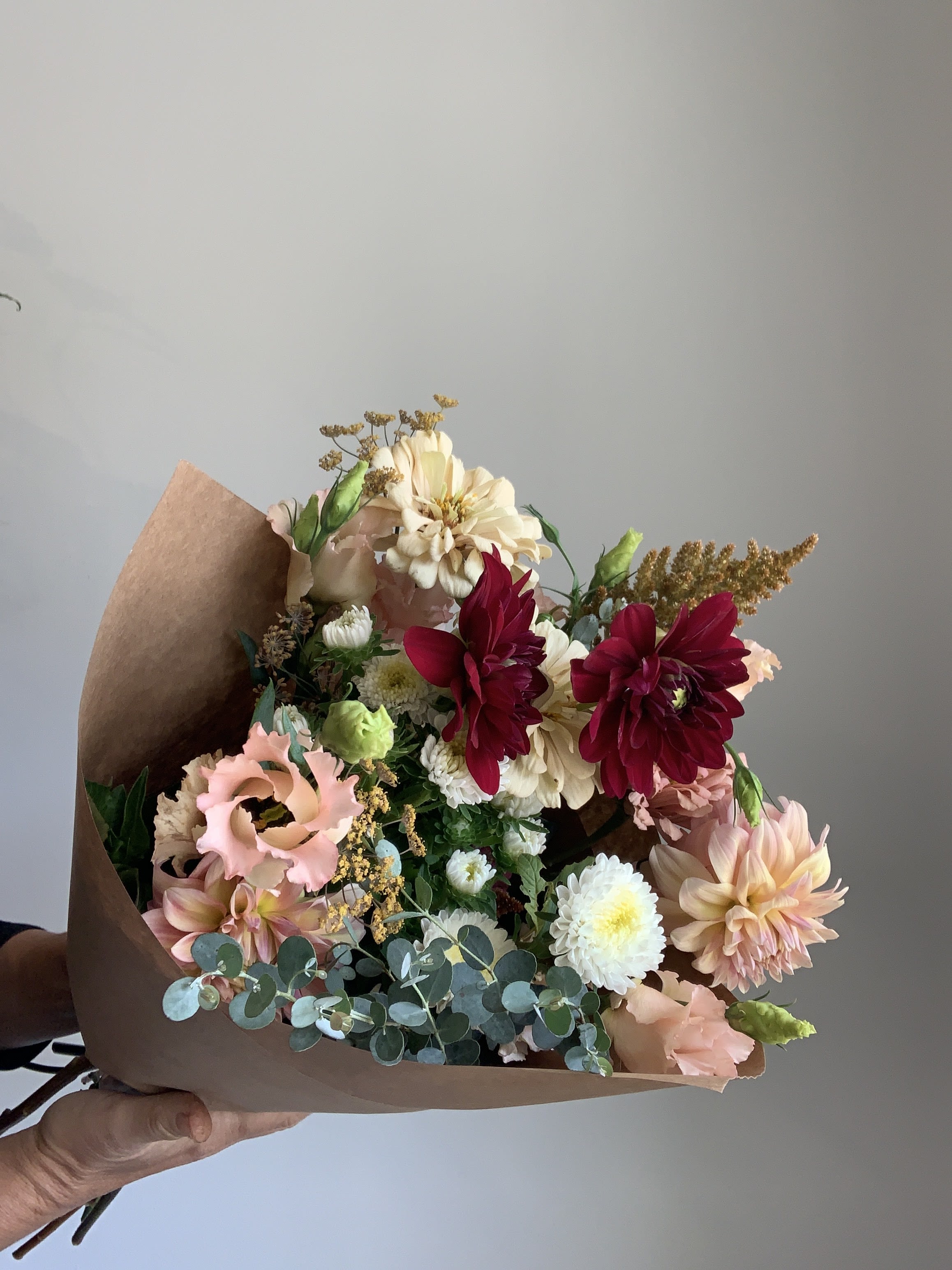 Autumn Series - Market Bouquet Autumn Series - Market Bouquet - Send a beautiful autumn seasonal bouquet. Seasonal blooms may include dahlias, lisianthus, heirloom chrysanthemum and celosia and come wrapped so that your recipient can arrange them in their own vessel.