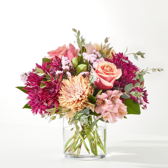 Berry Cobbler Bouquet - Need to sweeten up someone's day? Look no further than the Berry Cobbler Bouquet! Peach roses, purple cushion chrysanthemums, and pink alstroemeria are a welcome addition to the dessert table! Vase style may vary.