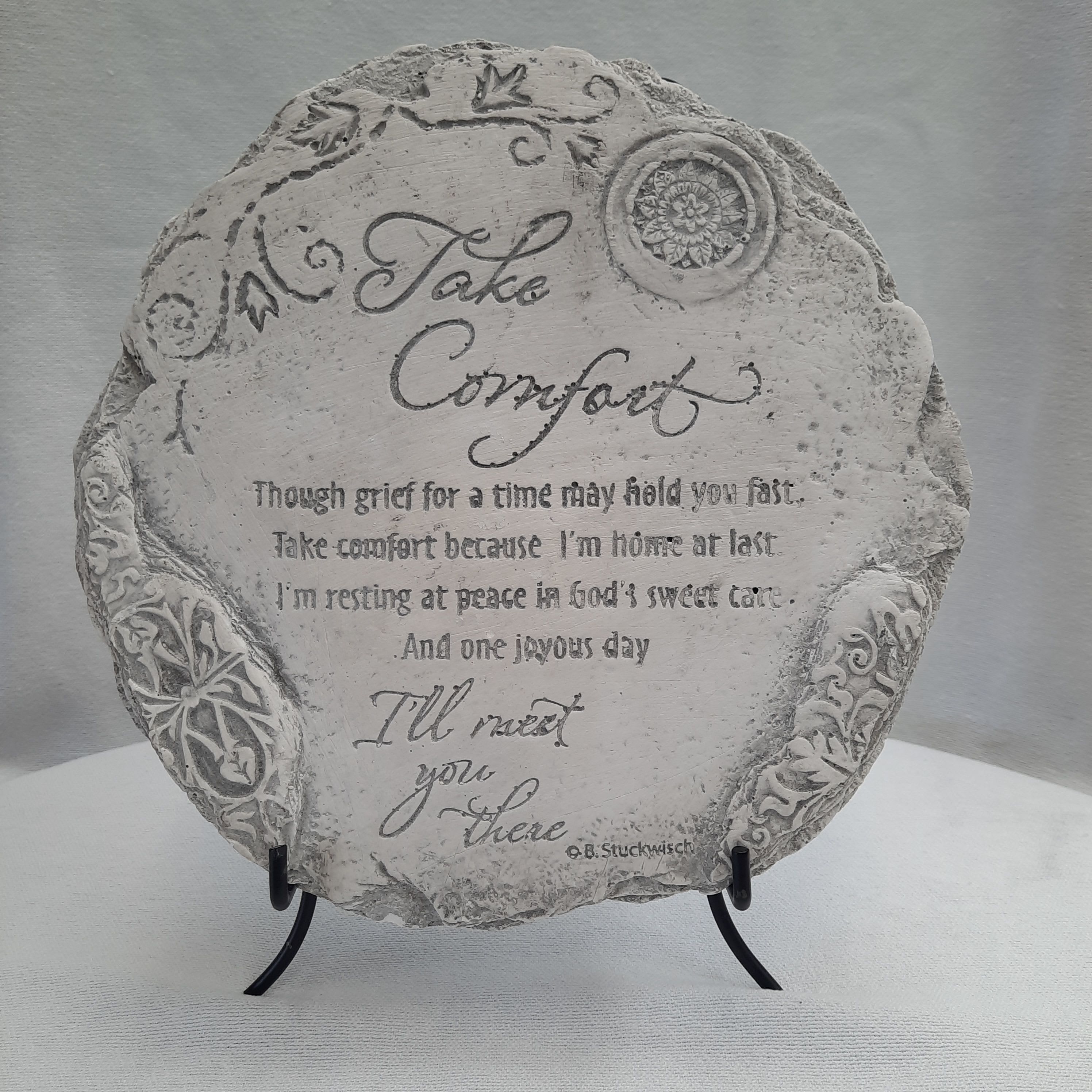 Take Comfort Sympathy Stone - A serene reminder of God’s comfort and eternal love, it offers solace and hope during times of sorrow. Perfect for memorials or a special space of remembrance, this concrete sympathy stone serves as a lasting tribute to faith, love, and the promise of everlasting life. EASEL NOT INCLUDED. Purchasing Easel Style #3 or #4 is recommended or using its attached hanger. Approximately 9 1/4 inches in diameter, and 1/2 inch in depth. 