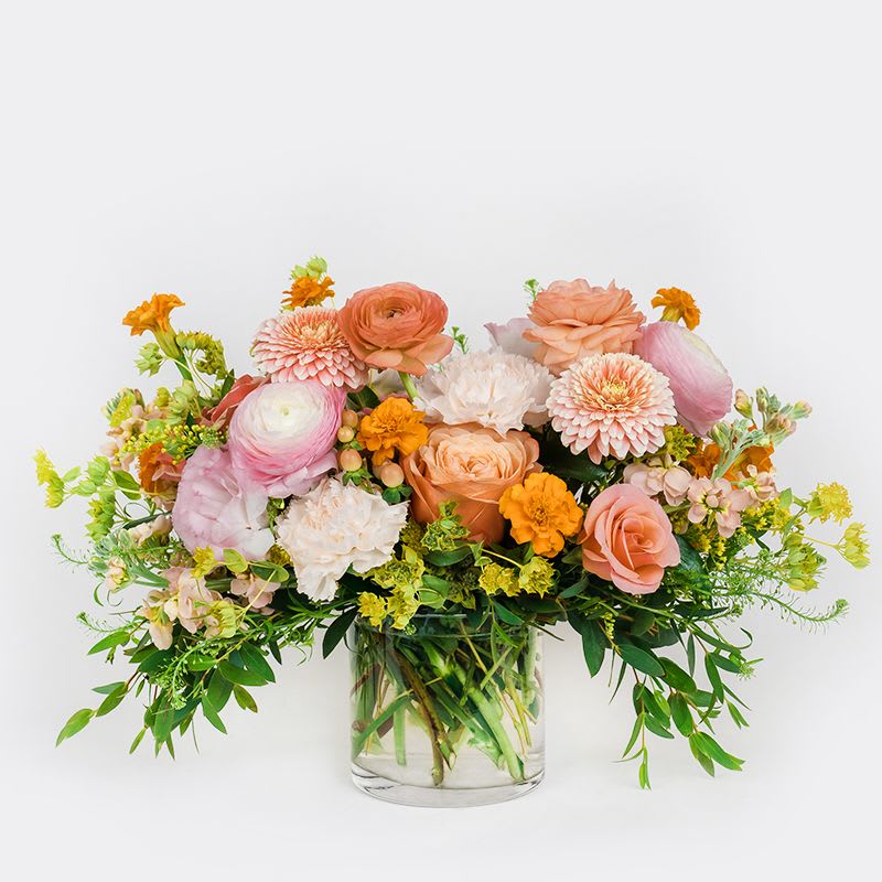 Summer Sorbet - Introducing a fun and cheerful modern arrangement that beautifully captures the transition from warm late summer days to the crisp, cozy feel of autumn nights. Filled with seasonal blooms and lush foliage, it’s designed to bring a fresh, vibrant touch to any space while celebrating the changing seasons in style.
