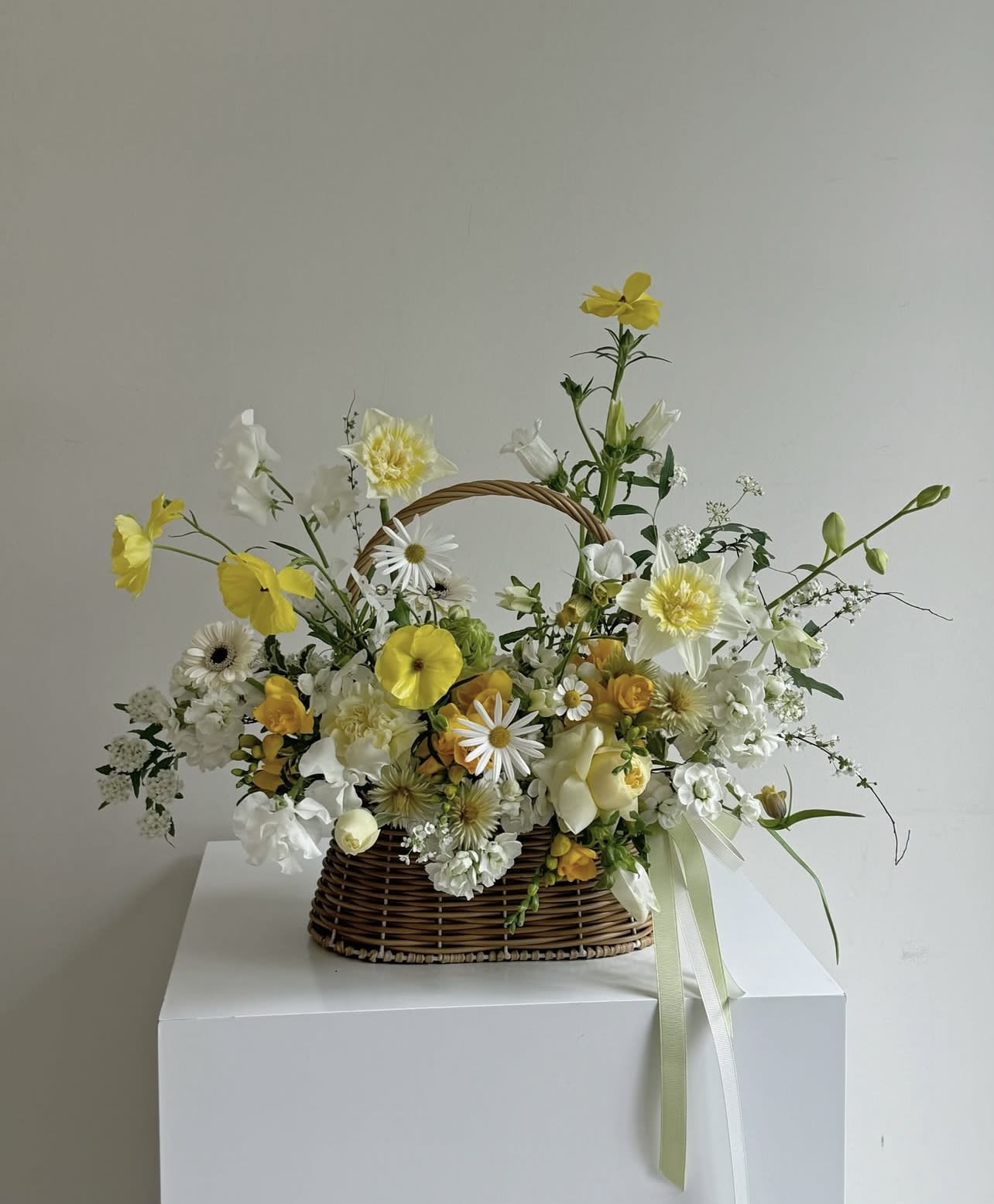 Golden Verse Golden Verse - A soft ode to sunlight, Golden Verse radiates warmth and quiet joy through every petal. With a harmony of buttery yellows, gentle oranges, and creamy whites, this basket arrangement feels like the first light of morning — hopeful, gentle, and full of life. Perfect for brightening a space, celebrating a new beginning, or sending a little light someone’s way, Golden Verse speaks in a language of softness and glow — no words needed.