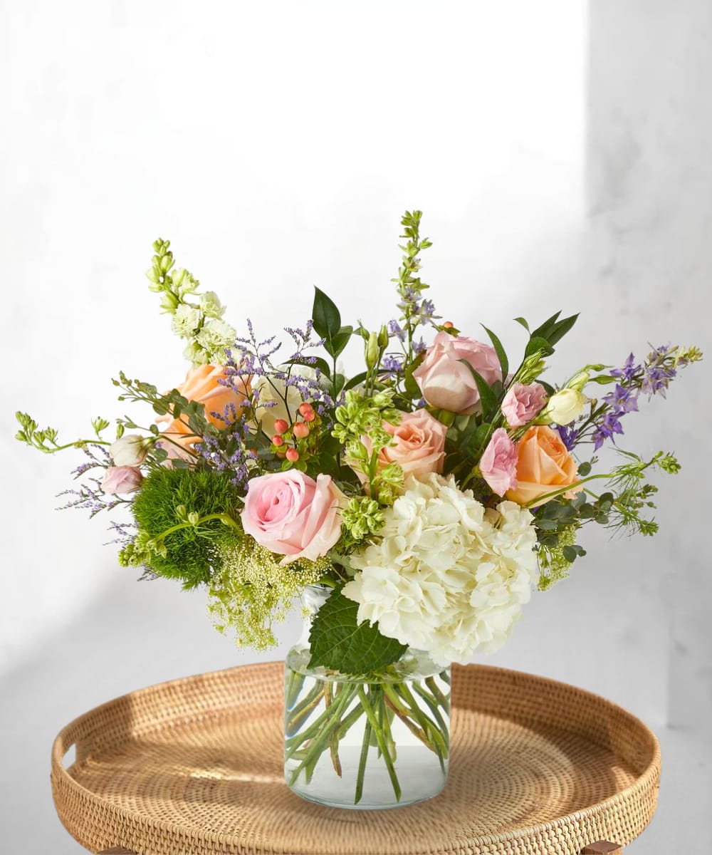 Garden Muse - Soft, airy, and painterly in style, the Garden Muse evokes the charm of a countryside garden in full bloom. This artful arrangement features a romantic blend of roses, larkspur, hypericum berries, Queen Anne’s lace, trick dianthus, and limonium—each stem thoughtfully placed to create a natural, just-picked feel. Perfect for celebrating creativity, love, or simply brightening someone’s day, this bouquet feels like a living brushstroke of beauty. What’s included? Roses, Larkspur, Hypericum Berries, Queen Anne’s Lace, Trick Dianthus, Limonium, and Seasonal Foliage.