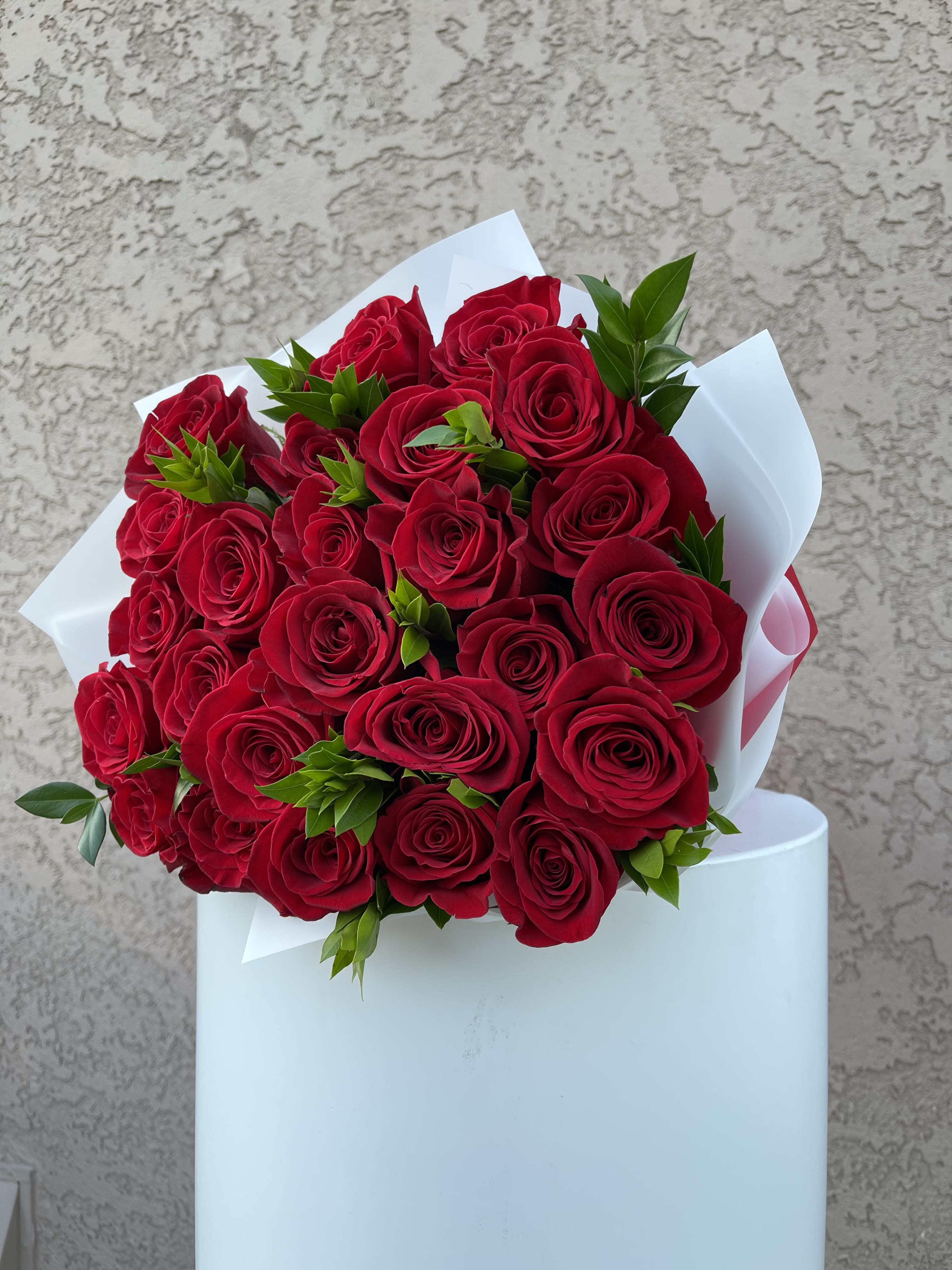 Crimson Devotion - Express pure passion with Crimson Devotion, a luxurious bouquet of fresh, velvety red roses elegantly wrapped and hand-tied. Designed in the heart of Beverly Hills, CA and available for delivery throughout Los Angeles, this stunning arrangement is perfect for anniversaries, romantic gestures, or meaningful celebrations. Handcrafted by Family Tree Flower, your trusted Beverly Hills florist offering same-day flower delivery across the greater LA area.  Red Roses – Deep love, passion, desire, and respect.