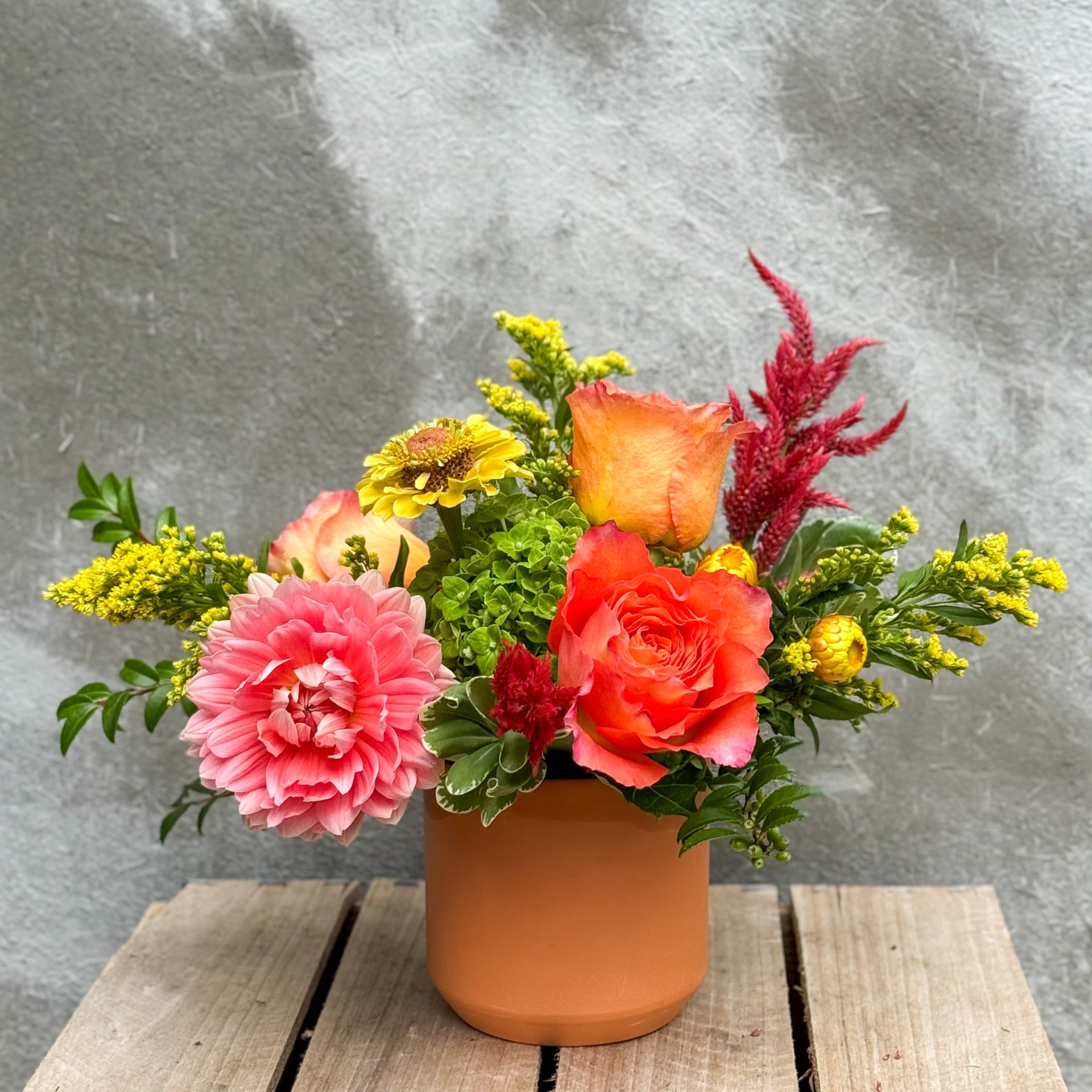 Citrus Dream - Celebrate these warmer days with a radiant arrangement of lemon and apricot blooms, featuring all the goodness this local flower season has to offer! Upgrade to deluxe and premium for additional blooms. 
