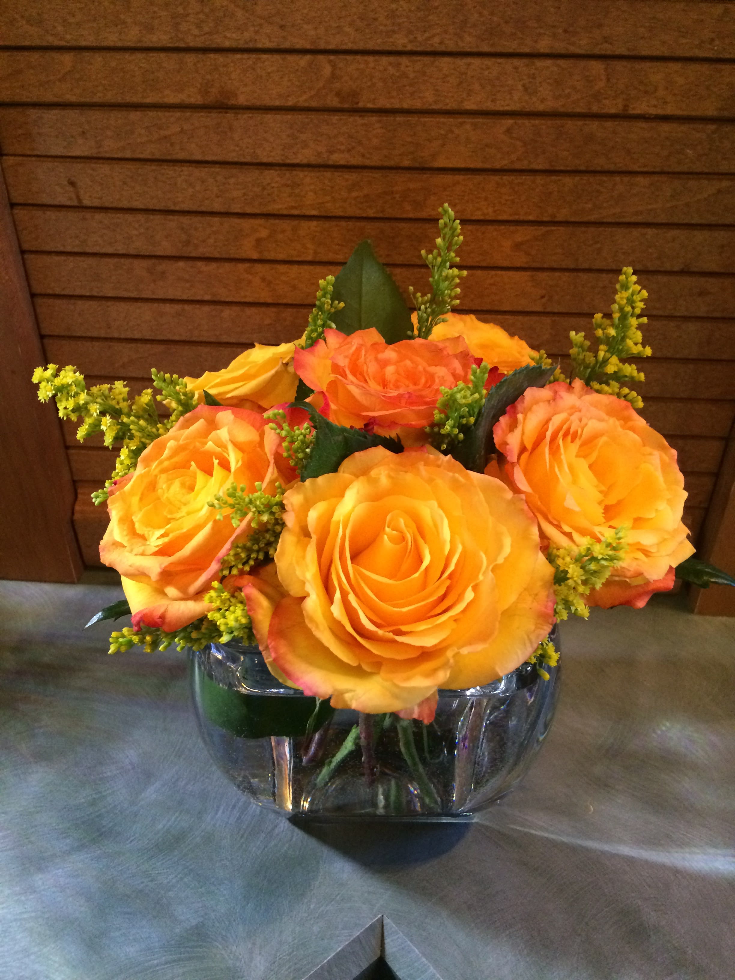 This Magic Moment  - A beautiful vase of 6 choice yellow roses with filler is the perfect gift, hand delivered to your someone special to give them a magic moment. (Will arrive 1/2 open, to bloom into this design.)  Reusable glass vase can be used for sweets after the flowers fade. Inventory count: 2