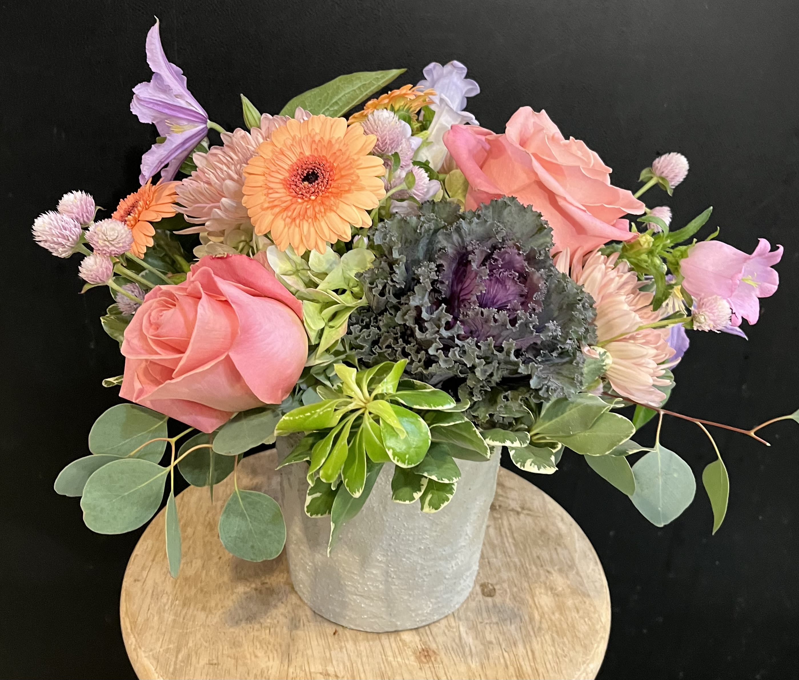 Dusty Autumn -   Not a fan of orange and yellow ? This non traditional  autumnal arrangement is perfect for you .   Purples , pinks , peaches  and greens..... gathered in a ceramics container .   Approx 14”tall 
