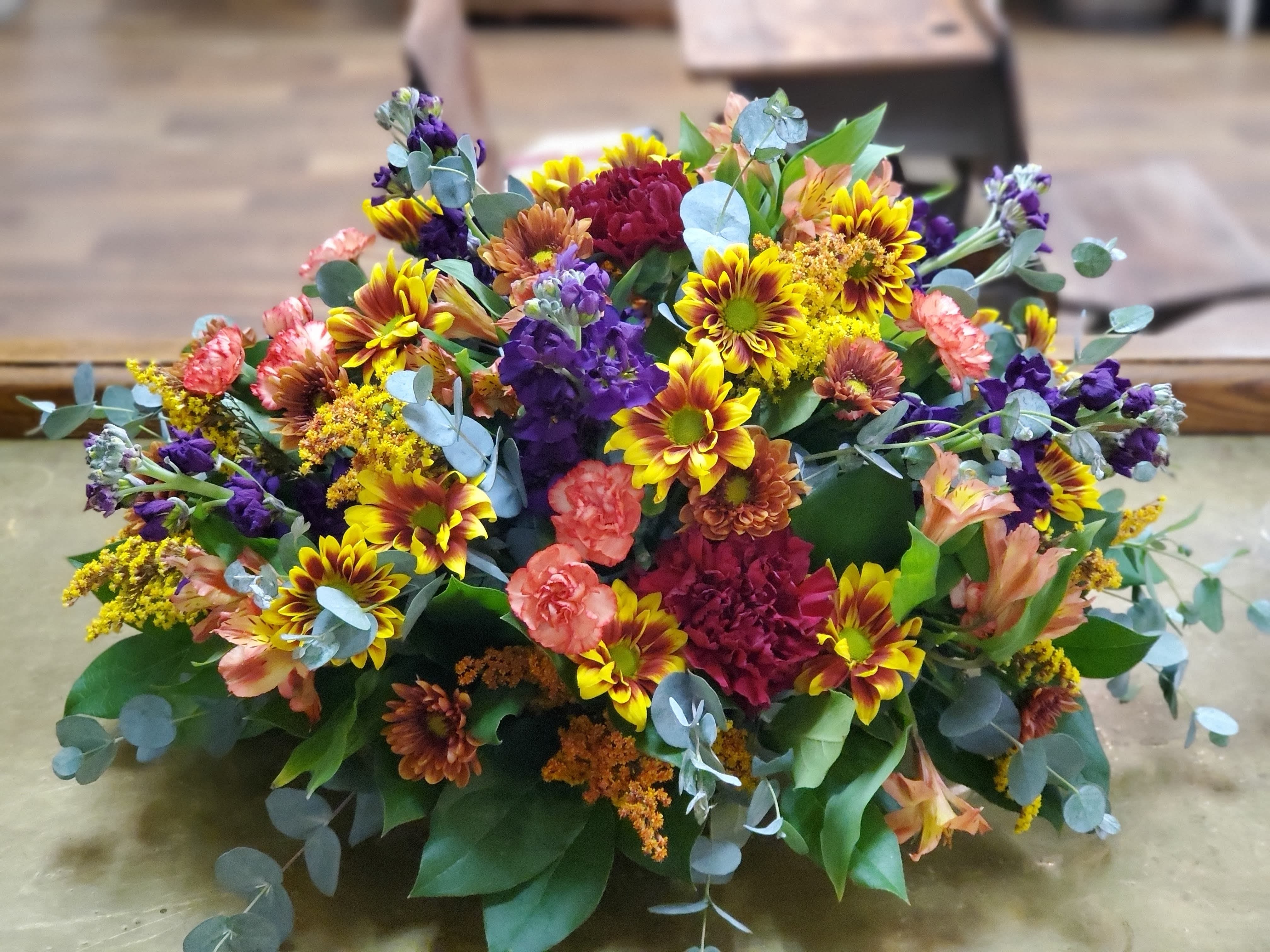 Fall Centerpiece With Purple - Centerpiece for the table with daisies, stock, carnations, mini carnations and alstroemeria in fall colors