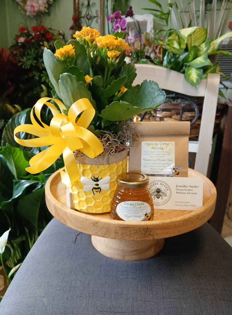 Bee Well - Help someone &quot;bee well&quot; with this wonderful combination of Cleansing Peace Tea, Raw honey, and a plant in a cute bee container. Standard includes plant in planter, tea, and honey Deluxe includes plant in planter, tea, honey, balloon and mug premium includes plant in planter, tea, honey, balloon, mug, and bee stuffed animal Tea is bag with 5- 2oz bags, and honey is 3oz jar