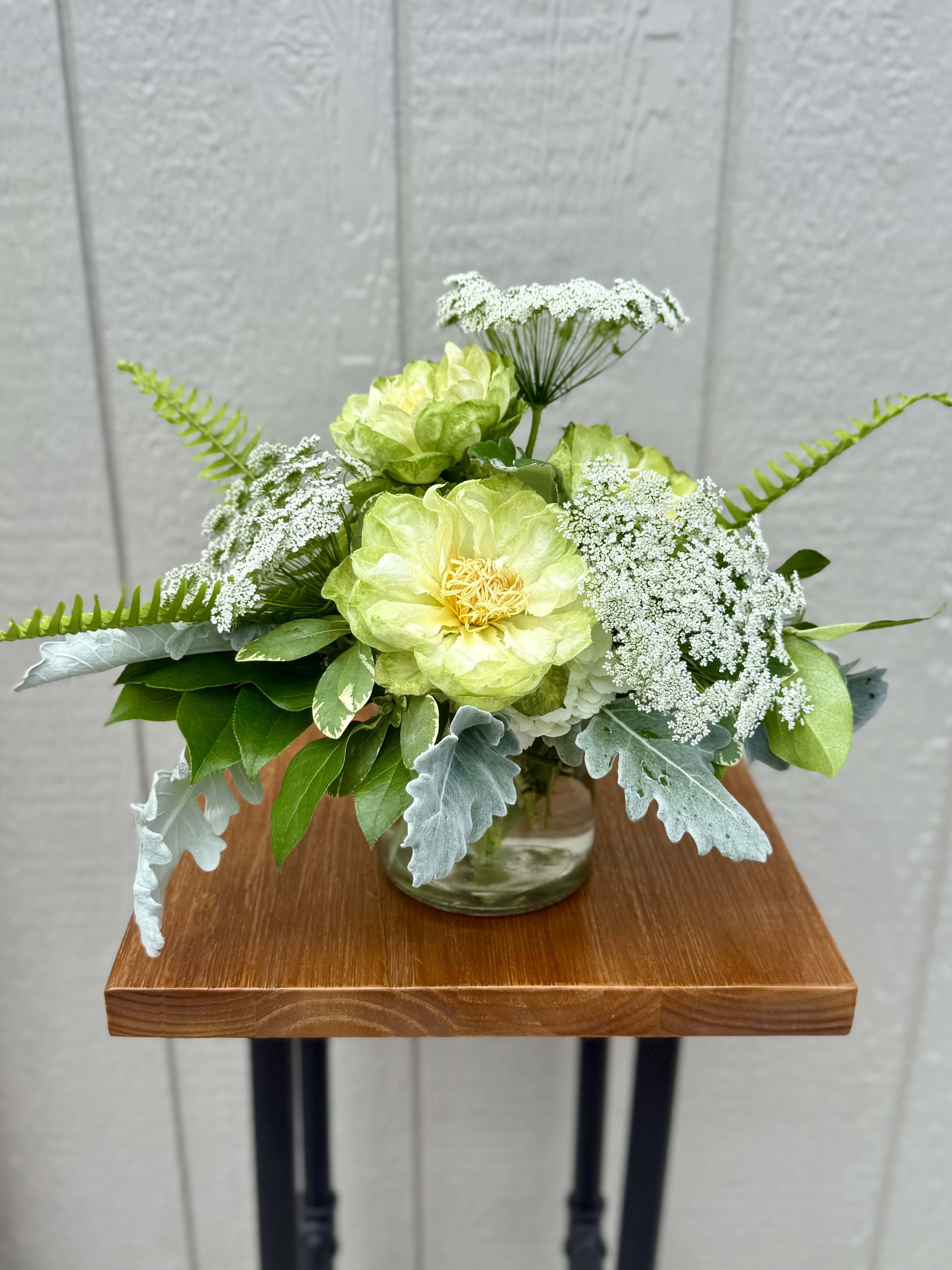 The Veggie The Veggie - Very simple green and white arrangement consisting of veggie roses and Queen Anne’s lace.