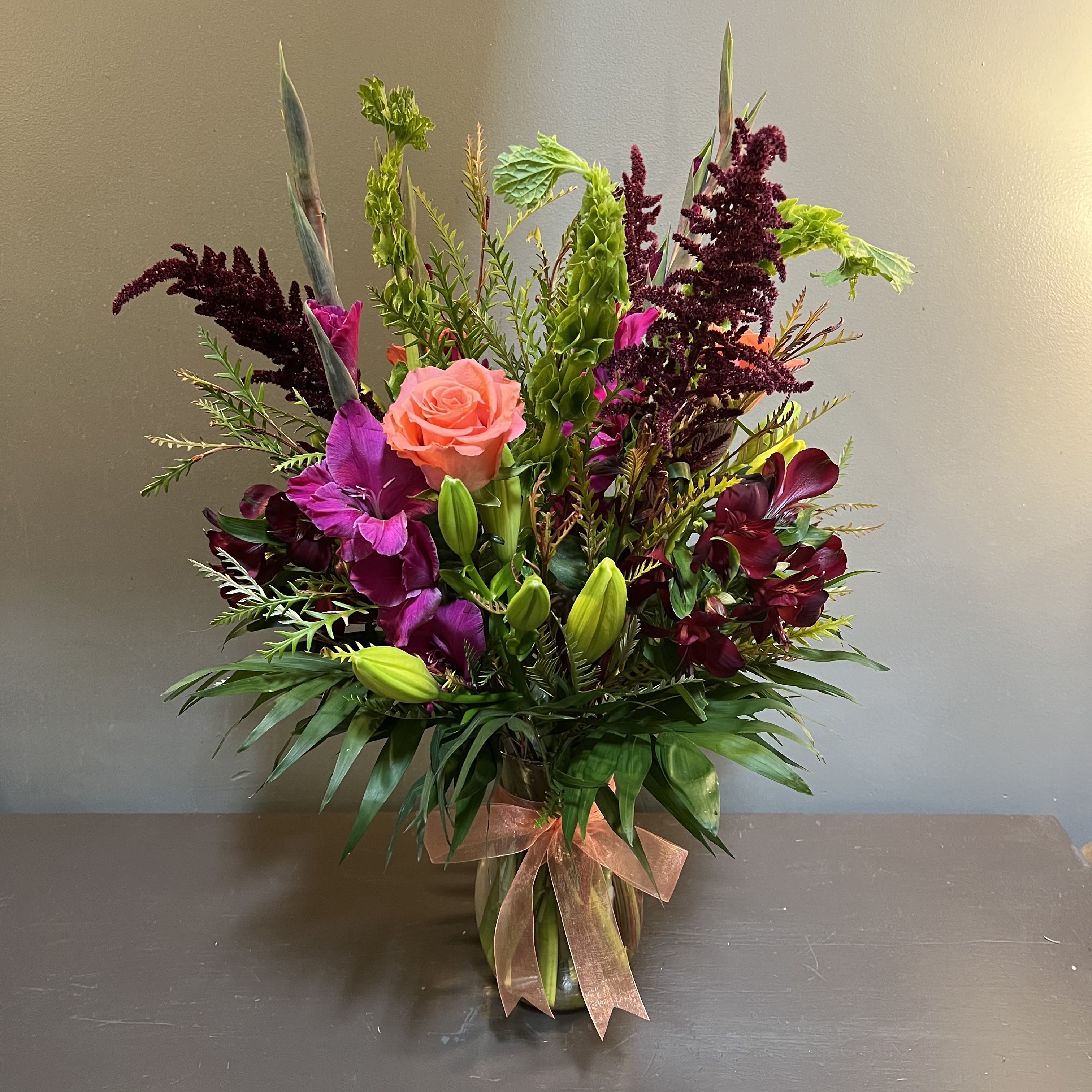 Jewel of my Eye - A jewel toned bouquet filled - much of it MN grown!  Measures approx. 27&quot; tall x 16&quot; wide and arrives in a glass vase.
