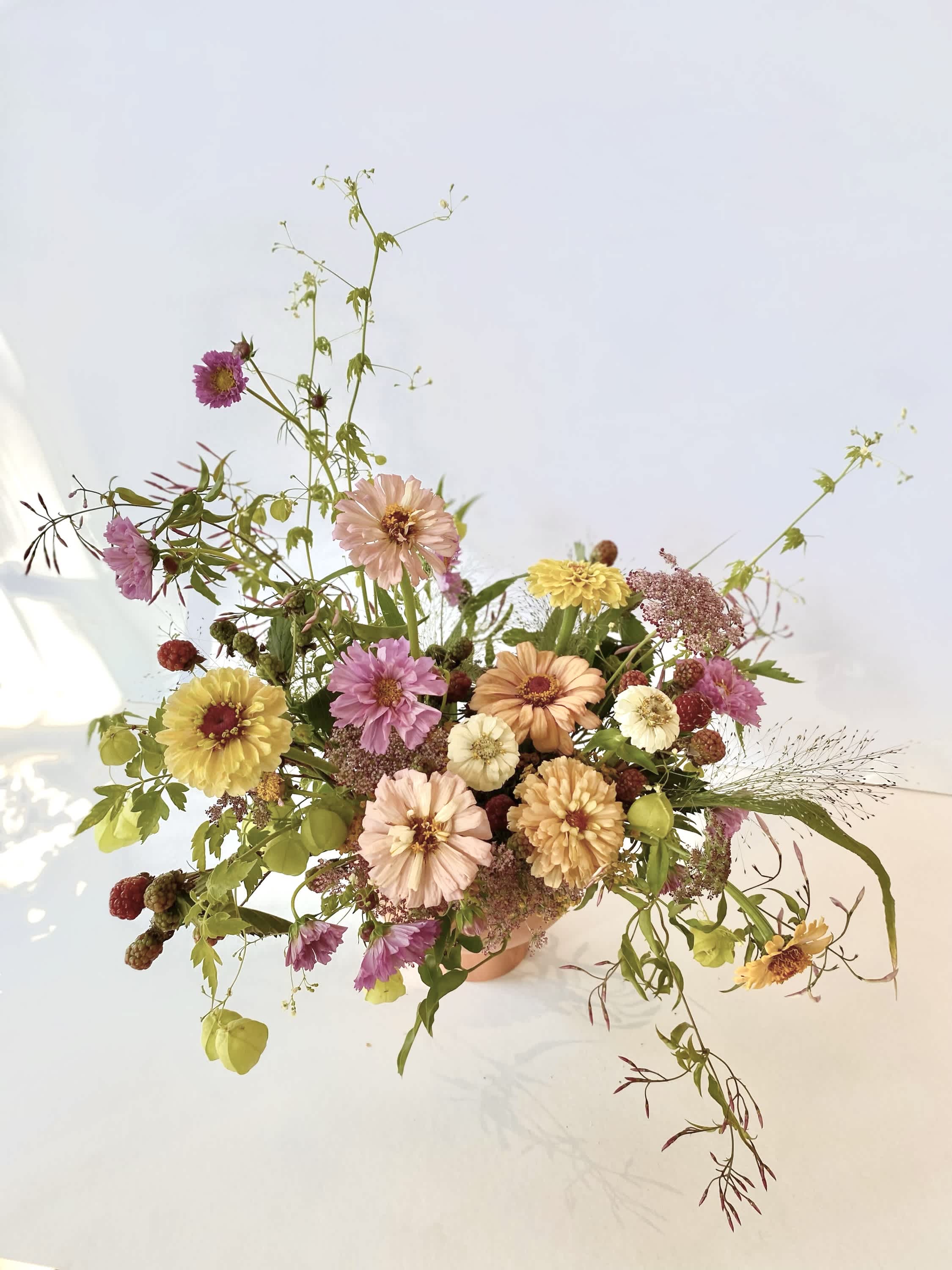 &quot;Zinnia Patch&quot; Arrangement  - A very cute and eclectic listing with locally grown zinnias as the focal point. Fashioned in a white or terracotta colored compote.   Concerning Seasonality: As a seasonal, locally-focused florist, we have different product to work with each week. Our focus is on creating a unique piece for each customer, with blooms that are fresh from local farms and growers. While the flower varieties and colors may vary, the quality and freshness will always be the best. It is an honor to have our customers' trust and confidence in our abilities and artistic eye.   Delivery Policy (**PLEASE READ**): Pick-ups at the studio are available after 2pm. Our daily delivery time frame is typically between 12- 3 PM. Please specify if you require a certain delivery time and we will do our best to accommodate it, or we will call you if we cannot.   We gently ask that those ordering flowers for someone else to please check first if the recipient of the flowers will be home during that time. Additionally, please be sure to include whether or not there is a gate we may need a code for. If there is no answer at the door, our delivery person will leave the flowers by the doorstep in a weather safe location. Completing your order acknowledges that you have read and understand our delivery policies. 