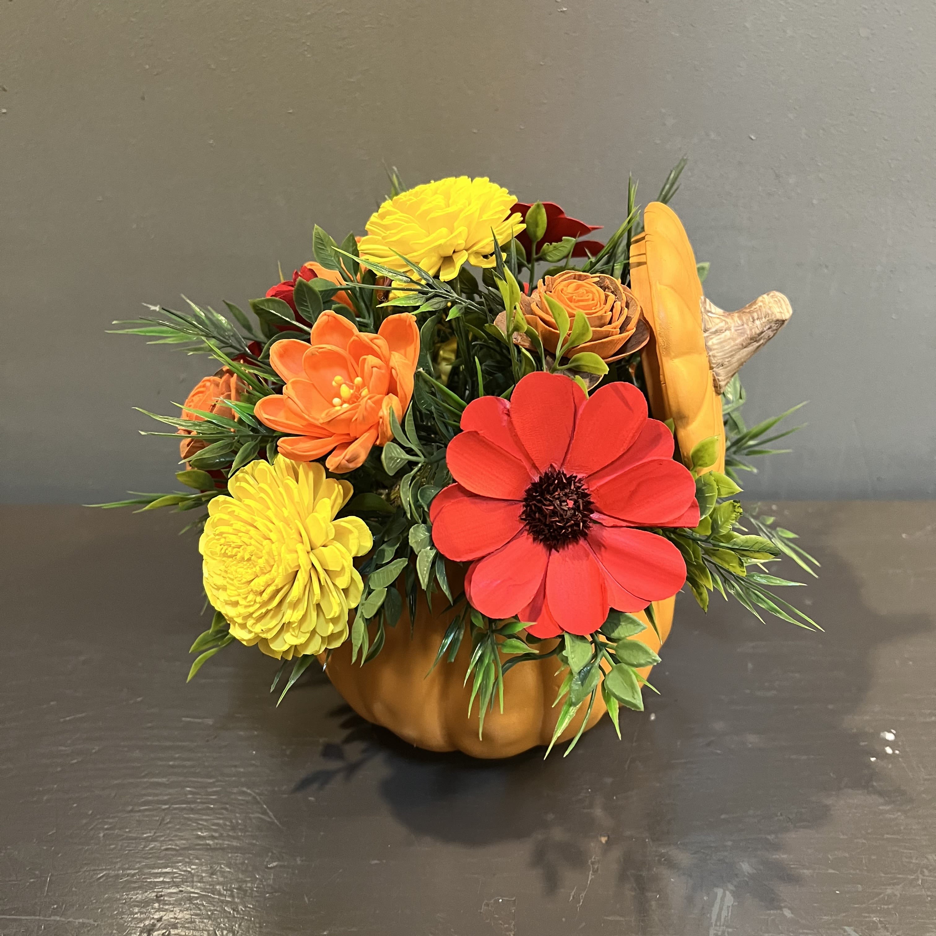 Sola Wooden Flower Centerpiece - Pumpkin Spice Sola Wooden Flower Centerpiece - Pumpkin Spice - Hand-dyed and hand-crafted in Minneapolis, these flowers made of balsa wood are a wonderful everlasting floral arrangement - great for those with allergies! Can be used as a natural essential oil diffuser too! Arrives in a keepsake pumpkin pot. Approx. Dimensions: 9"Tx9"W