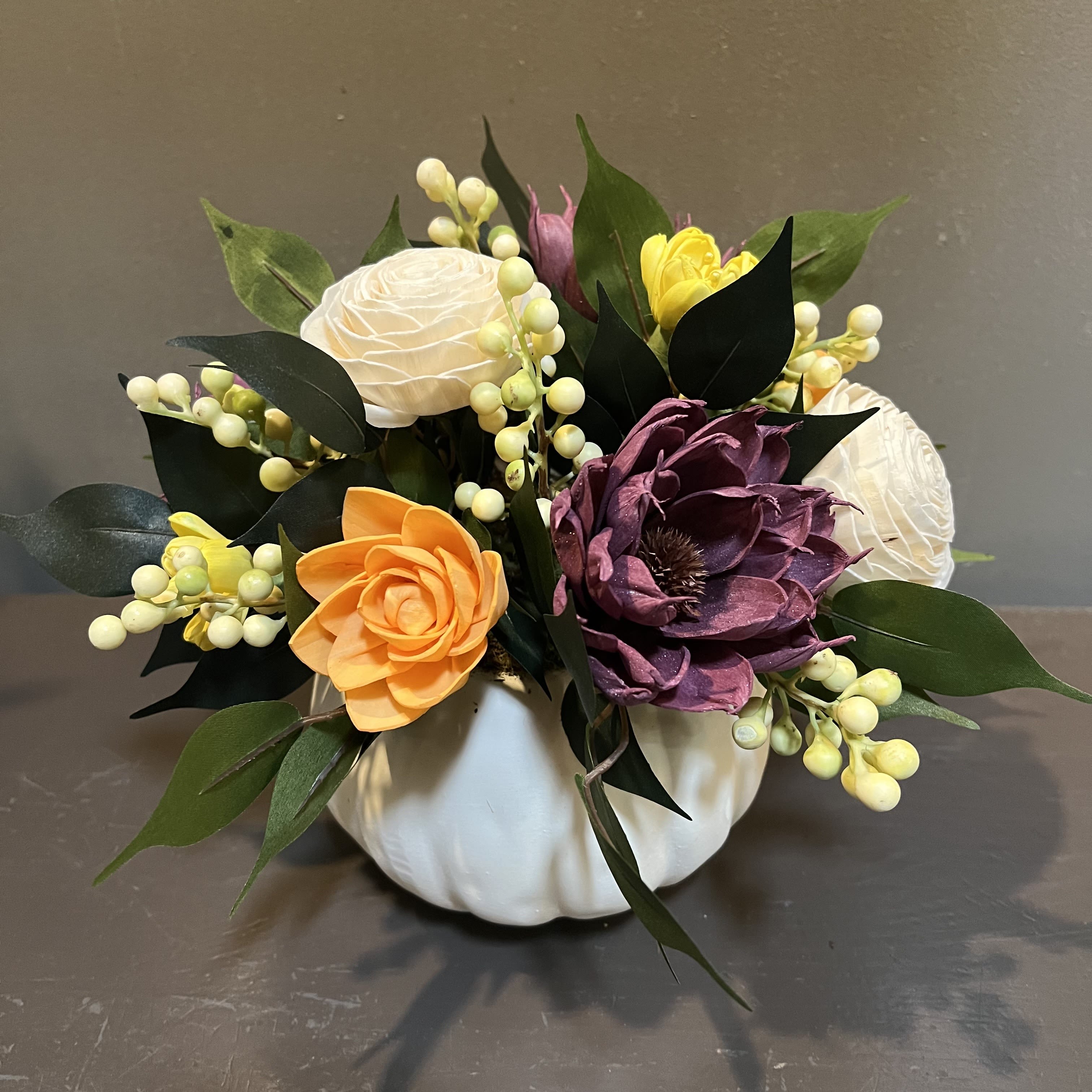 Sola Wooden Flower Centerpiece - Autumn Radiance Sola Wooden Flower Centerpiece - Autumn Radiance - Hand-dyed and hand-crafted in Minneapolis, these flowers made of balsa wood are a wonderful everlasting floral arrangement - great for those with allergies! Can be used as a natural essential oil diffuser too! Arrives in a white ceramic pumpkin. Approx. Dimensions: 10"Tx11"W