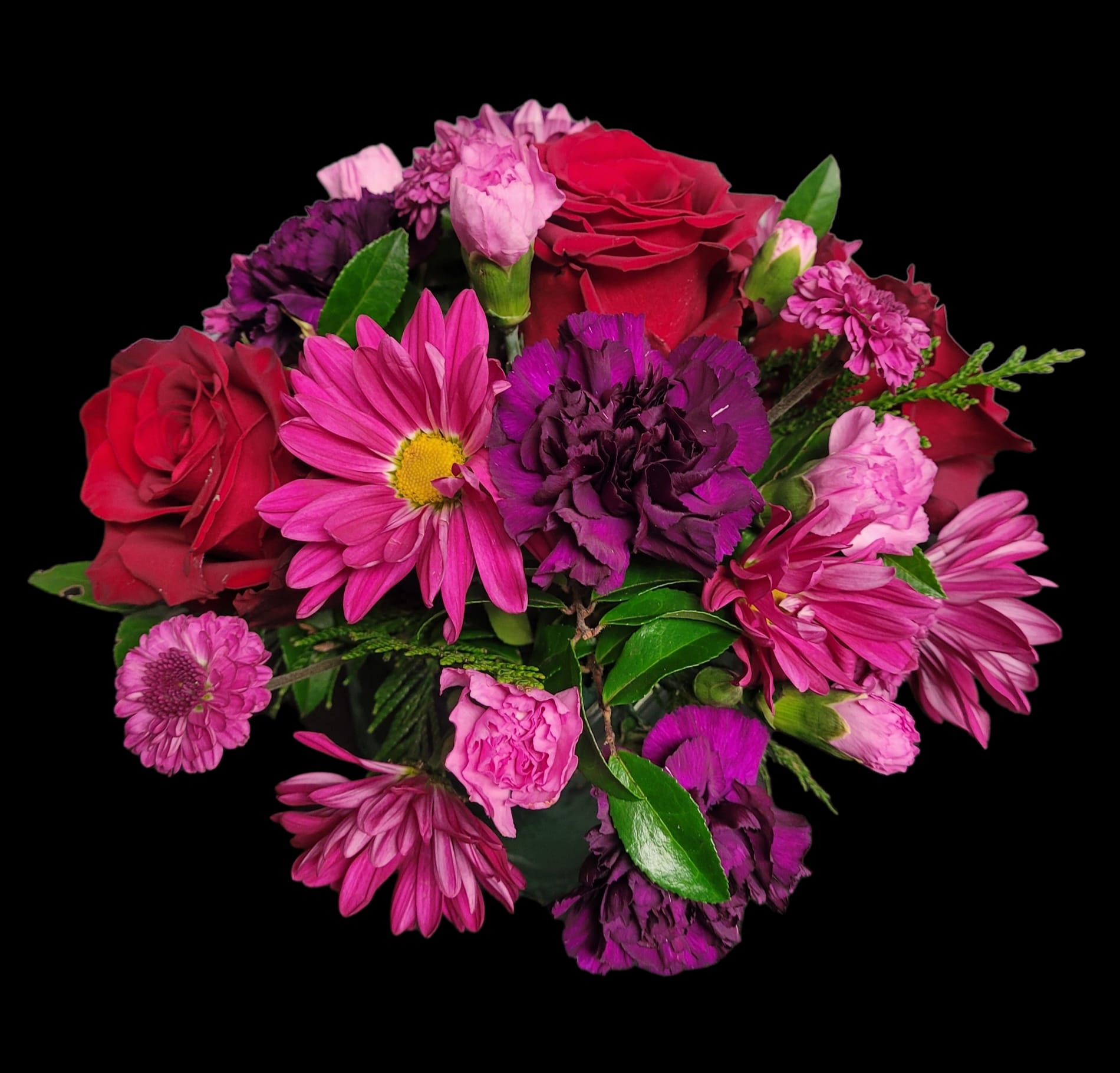 Boldly Beautiul - Our premium Red Explorer roses, deep plum Moon Vista carnations with a splash of purple or lavender seasonal blooms, a dramatic combination of rich reds and captivating purples creates a contemporary look that boldly stands out in any space.