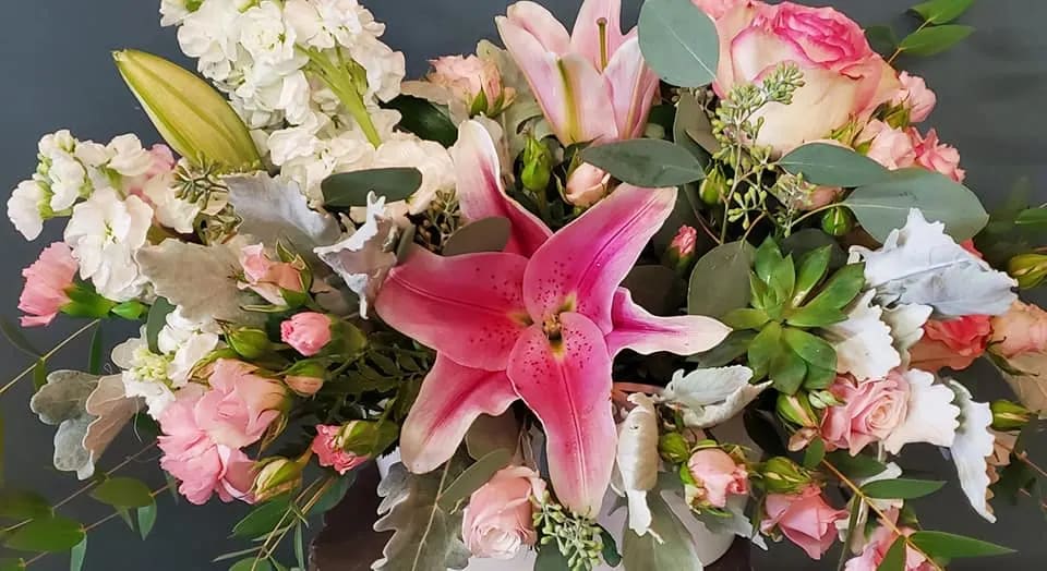 HELLO BEAUTIFUL GARDEN - THIS WHIMSY GARDEN FLORAL IN HIGHLIGHTED IN PINKS AND WHITE WITH A LIVING SUCCULENT PLANT ACCENT- THE RECIPIENT CAN THEN REPLANT THE PLANT AS A CONTINUAL GIFT IN THE CONTAINER RECEIVED.  COLOR SHADES AND CONTAINERS MAY VERY BUT WILL BE KEPT TO PINKS AND WHITES WITH SIMILAR LOOK AND FEEL