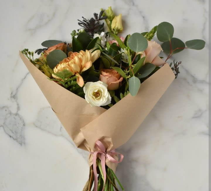 Wrapped In Love - Selected blooms will be handtied and wrapped in love for the recipient: you may choose to type preferred color theme in &quot;Delivery &quot; details, such as bold bright yellows, vibrant reds, soft pastels etc