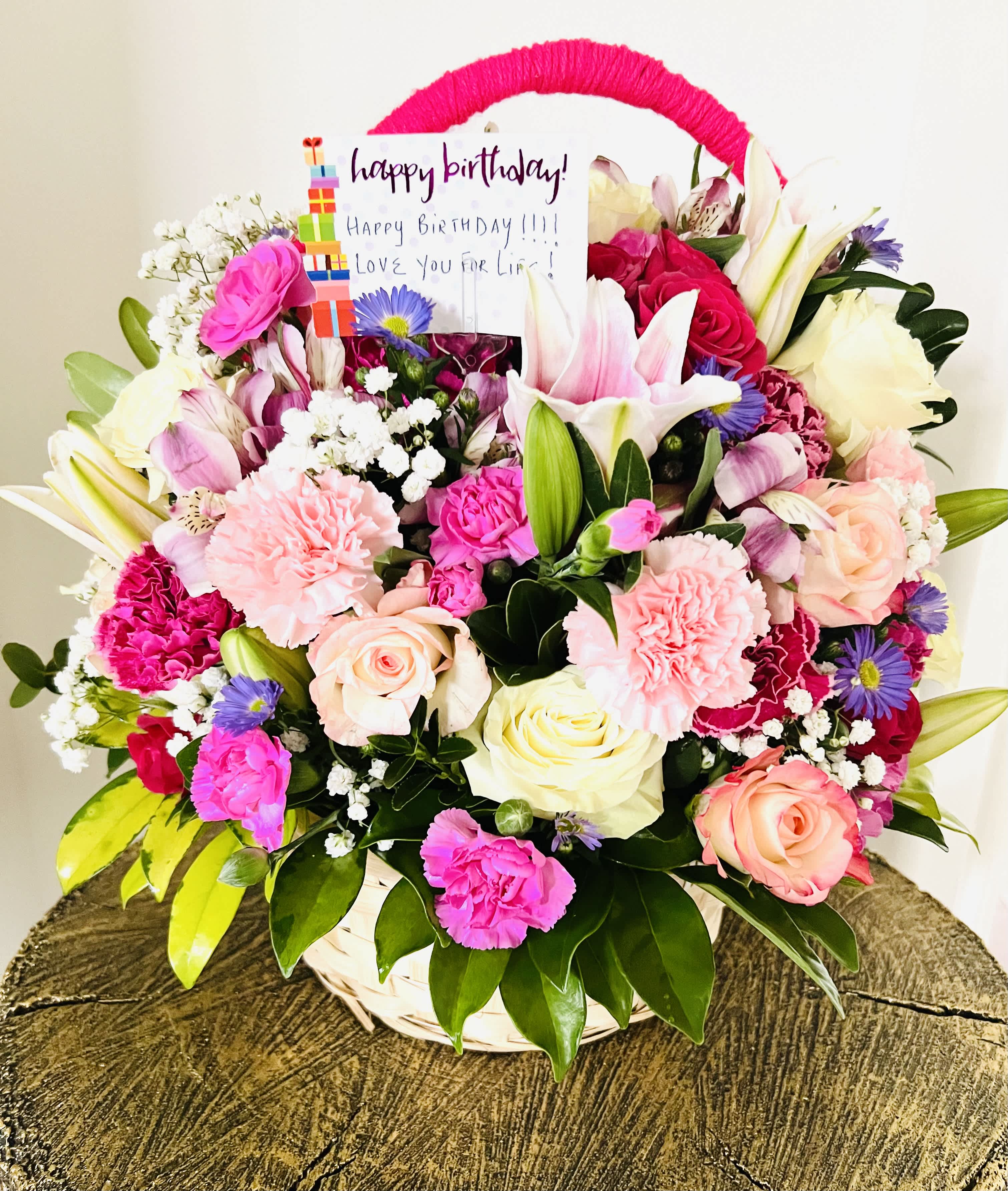 Pink Blush - This luxurious large full bodied basket of pink and white flowers is sure win to hearts. Arranged in a wicker basket, this arrangement is a stunning assortment of premium roses and seasonal blooms.This basket is a wonderful gift for  the moments you cherish with friends and family.For same day delivery and Free Delivery Options Text or Call  832-973-1376.