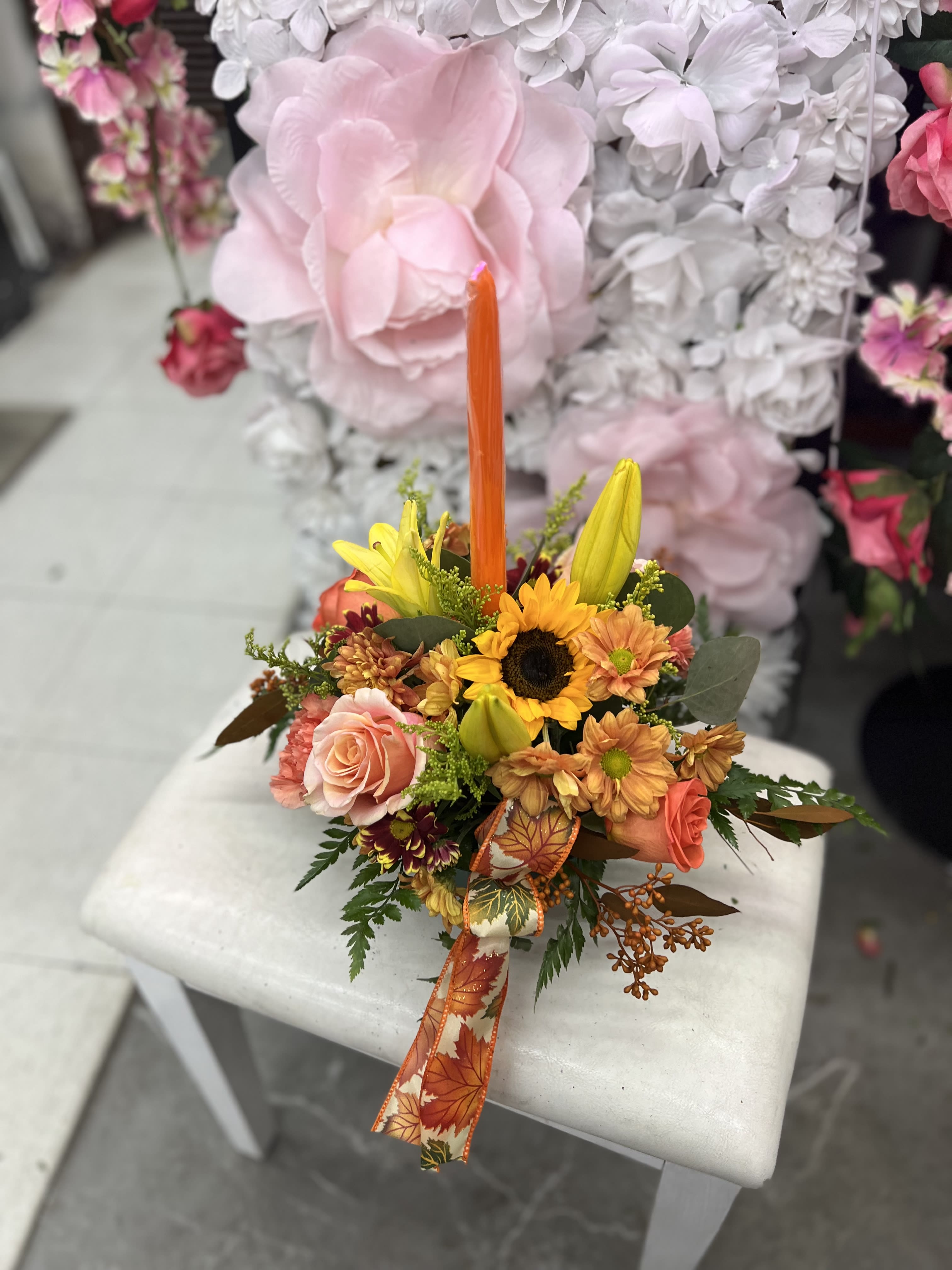 1 single candle centerpiece  - Please Note: The bouquet pictured reflects our original design for this product. While we always try to follow the color palette, we may replace stems to deliver the freshest bouquet possible, and we may sometimes need to use a different vase.  SHARE SHARE ON FACEBOOK  TWEET TWEET ON TWITTER  PIN IT 