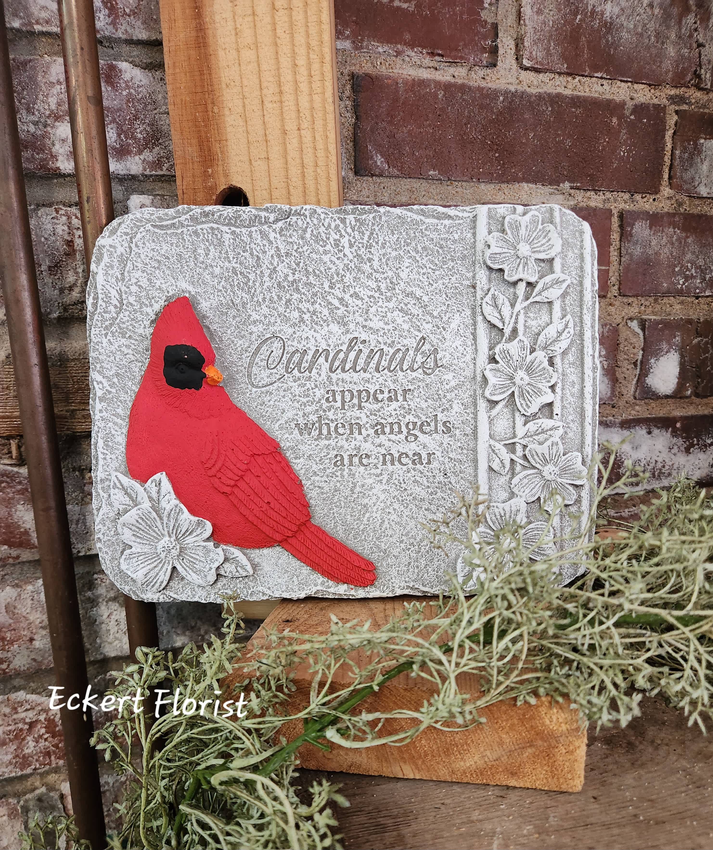 Eckert Florist's "Cardinals Appear..." Memorial Stone *OUR LOCAL DELIVERY ONLY Eckert Florist's "Cardinals Appear..." Memorial Stone *OUR LOCAL DELIVERY ONLY - Cement material Stone. Sentiment: "Cardinals appear when angels are near." Approx. 7.5" H X 9.5" W *See Add-on Section for Display Easel *May be added to a fresh arrangement or green plant. See Deluxe and/or Premium upgrades.