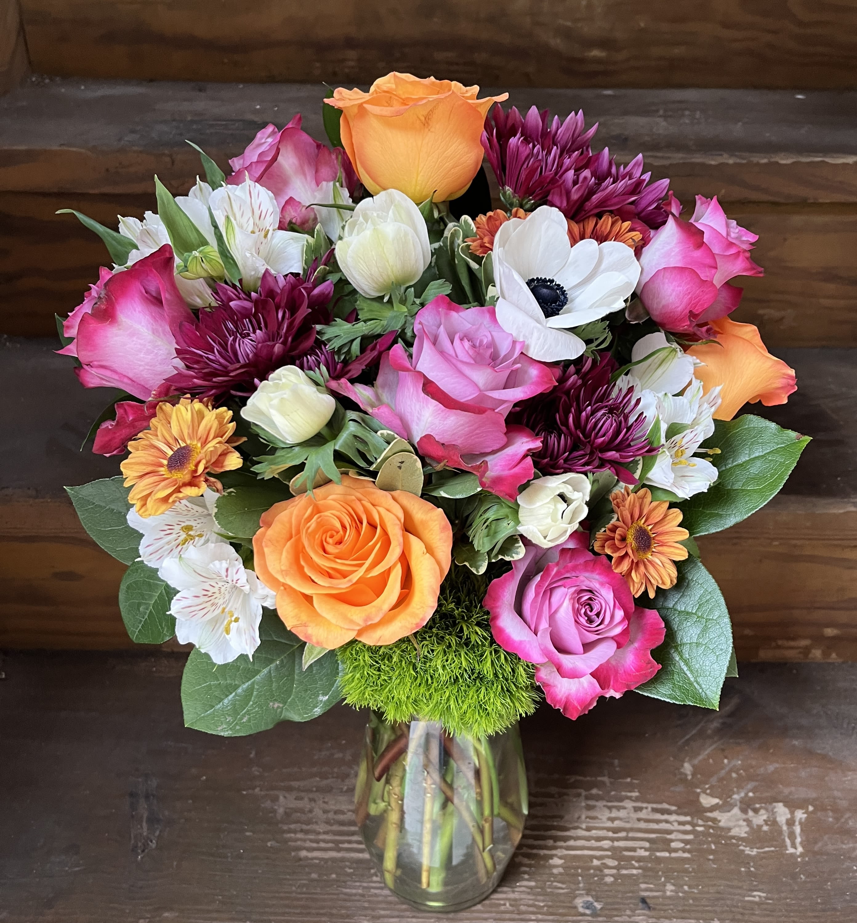 Birthday Blossoms - Bright Bouquet of Orange and Lavender Roses with Hot Pink Edges with white floral accents of Alstroemeria and Panda Anemone.