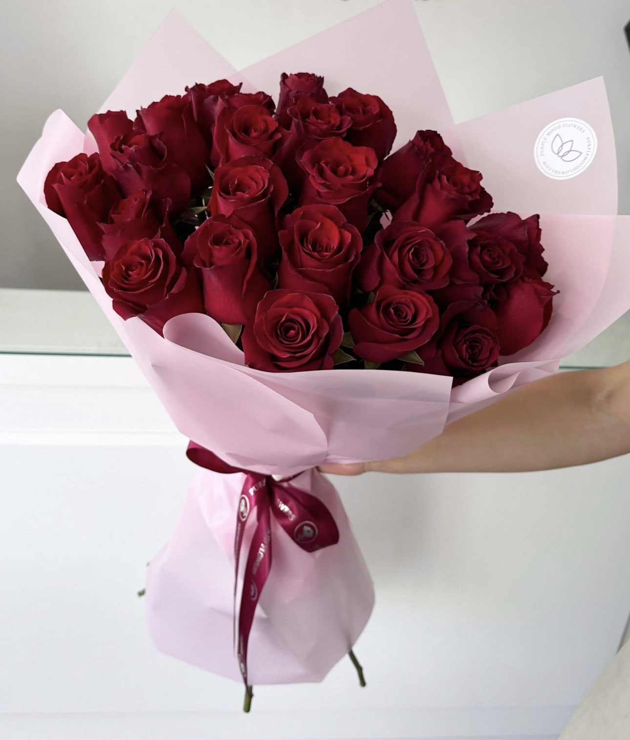 25 Red Roses Bouquet 25 Red Roses Bouquet - Elegant yet heartfelt, our 25 Red Roses Bouquet is the perfect way to express love, passion, and admiration. Hand-tied with care and wrapped in soft pink paper with a satin ribbon, this bouquet is both romantic and stylish — a beautiful gift for birthdays, anniversaries, Valentine’s Day, or simply to surprise someone special. • 25 premium red roses hand-selected for freshness and beauty • Wrapped in soft pastel paper with a satin ribbon finish • A romantic gesture that balances elegance with intimacy • Perfect for anniversaries, birthdays, Valentine’s Day, or just because VASE NOT INCLUDED