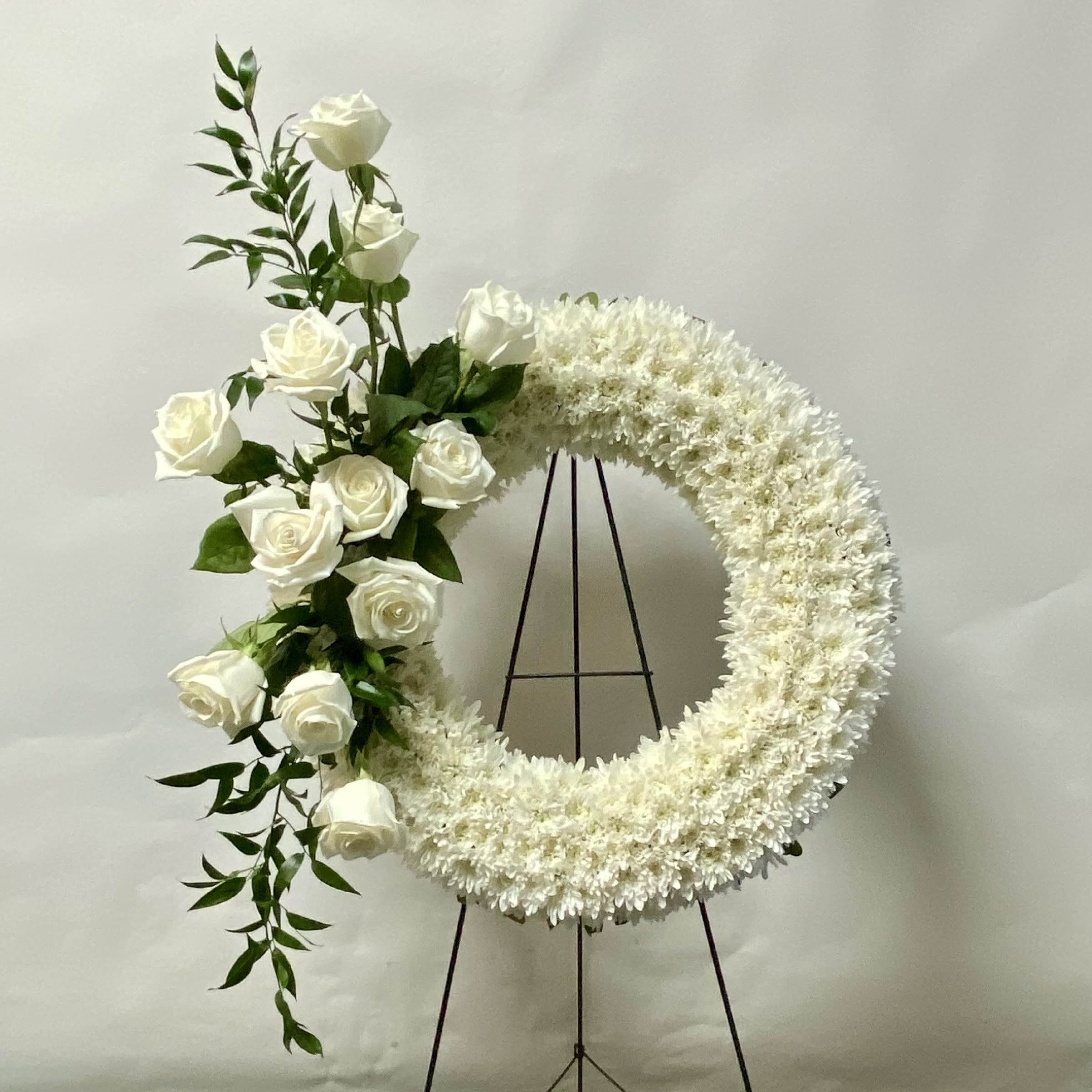 Orbit Wreath - This 24&quot; Wreath on an Easel Includes White Cushion Mums and White Roses. Or as Similar as Possible.