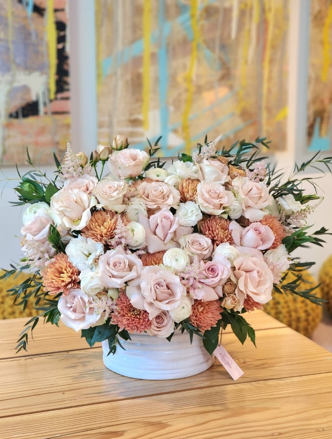 Example of Love - The incredible beauty of quicksand roses will captivate any woman. These stunning flowers embody grace and refinement, creating a composition that is both presentable and intriguing. Combined with delicate ranunculus and chrysanthemums, this arrangement is sure to enchant everyone. Perfect for weddings, anniversaries, or adding a touch of luxury to your home decor.