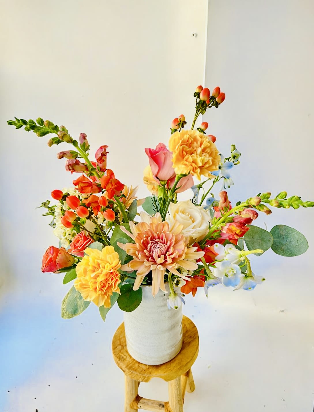 Hope - Please keep in kind that no arrangement can be made identical to the photos shown (as some flowers are seasonal). Therefore, we will substitute them accordingly with in-season flowers instead. We will do our absolute best to arrange the flowers as similar as possible with the photos shown!   For Bouquets, we DO NOT include vases unless you add one.  For Vased Flowers, we include vases.   Right now, you can expect fall blooms sourced from local farms.   We use small ordinary 4in by 3in cards. If you want to send flowers with a special messaging card, please choose one from add-ons!  Delivery: our standard delivery time window is between 3:00pm and 5:00pm.   If you have any questions regarding the order, please feel free to contact us!   Email: agapeflower.studio25@gmail.com