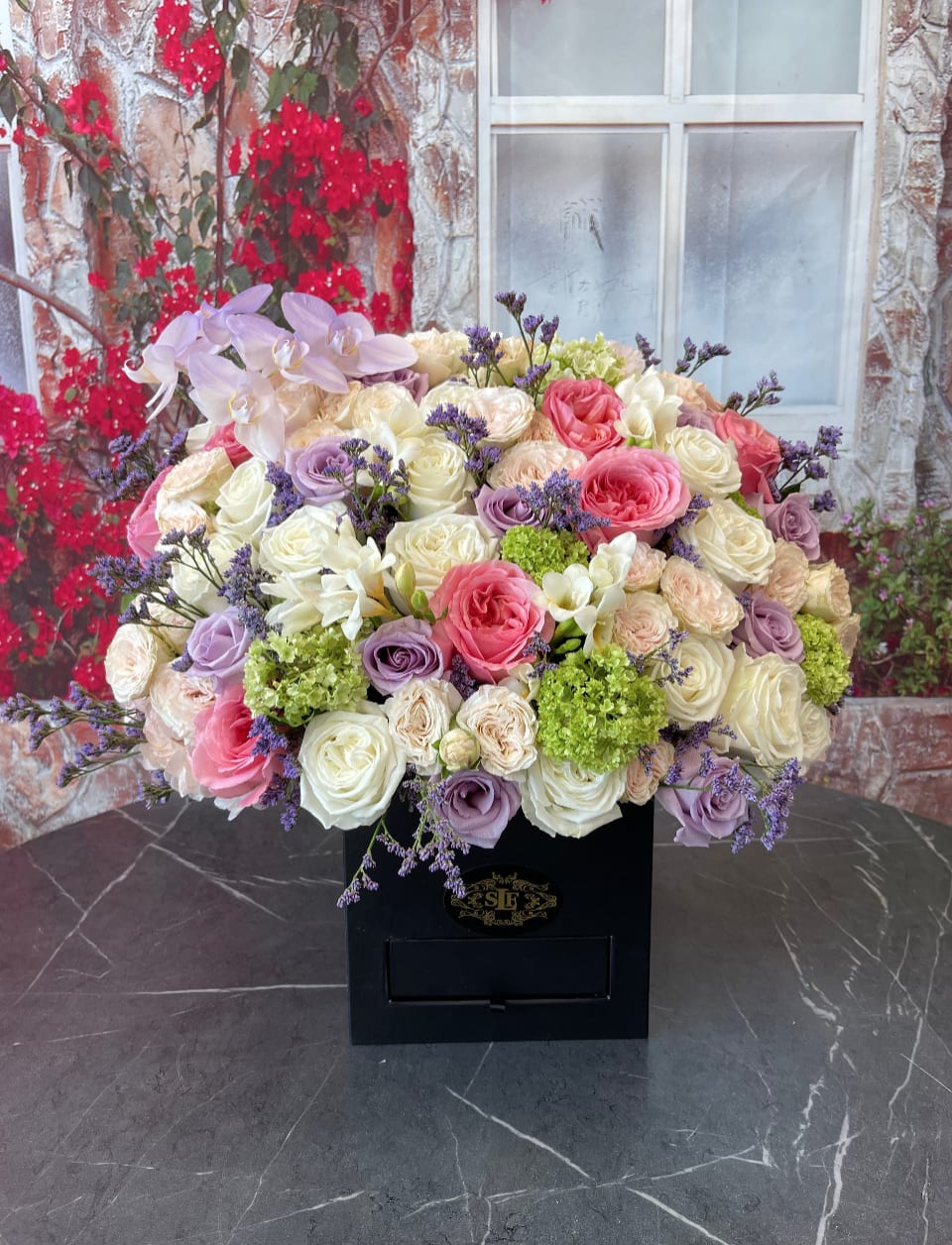 Black beauty Black beauty - Brighten any space with our Elegant Flower Box Arrangement! Bursting with vibrant blooms, this stunning display combines seasonal favorites with lush fillers. Housed in a chic, reusable container, it makes a perfect centerpiece for any occasion be it a gift or a treat for yourself. Elevate your decor with this captivating arrangement that brings joy and sophistication to your home or office. Order yours today and let the beauty of flowers inspire you!