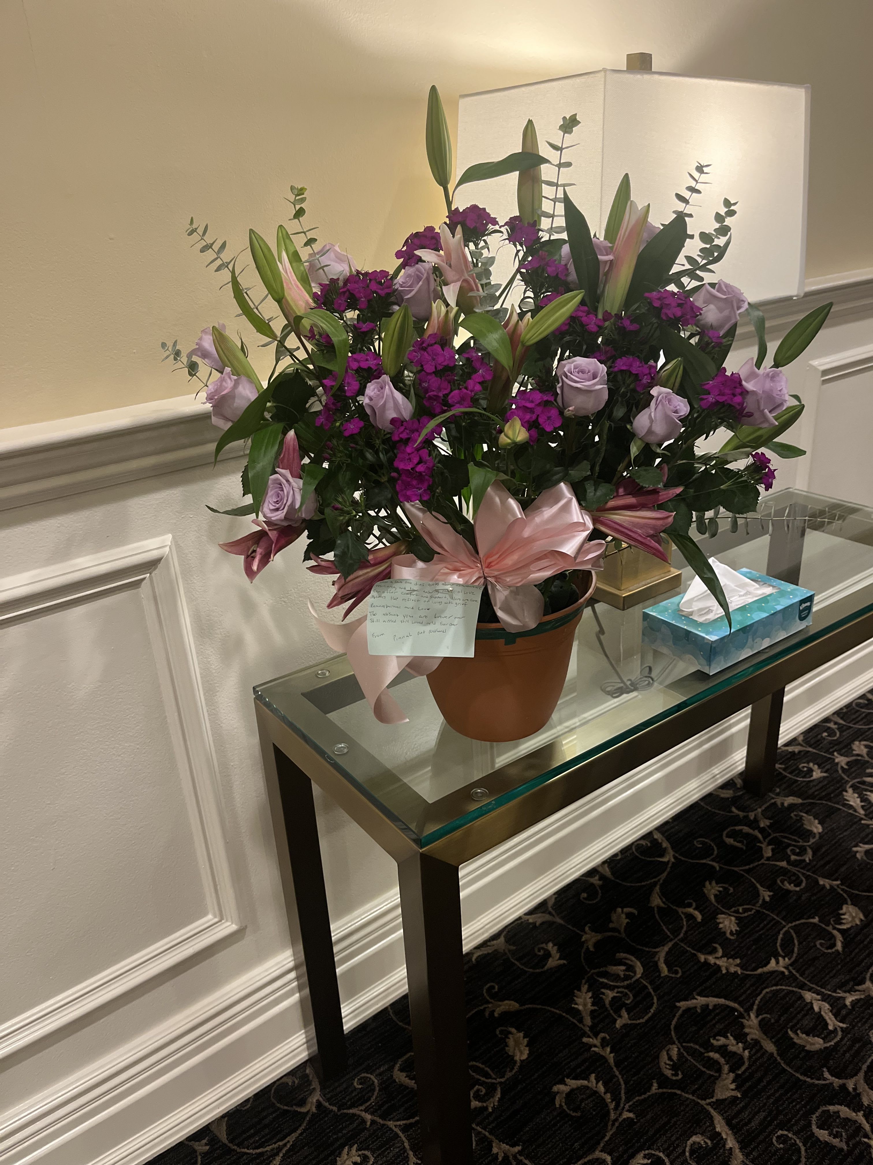 Purple Blessing by BloomNation™ Purple Blessing by BloomNation™ - A purple and white sympathy basket featuring snapdragons, roses, lilies, and stock. This fragrant arrangement works for every type of funeral ceremony.